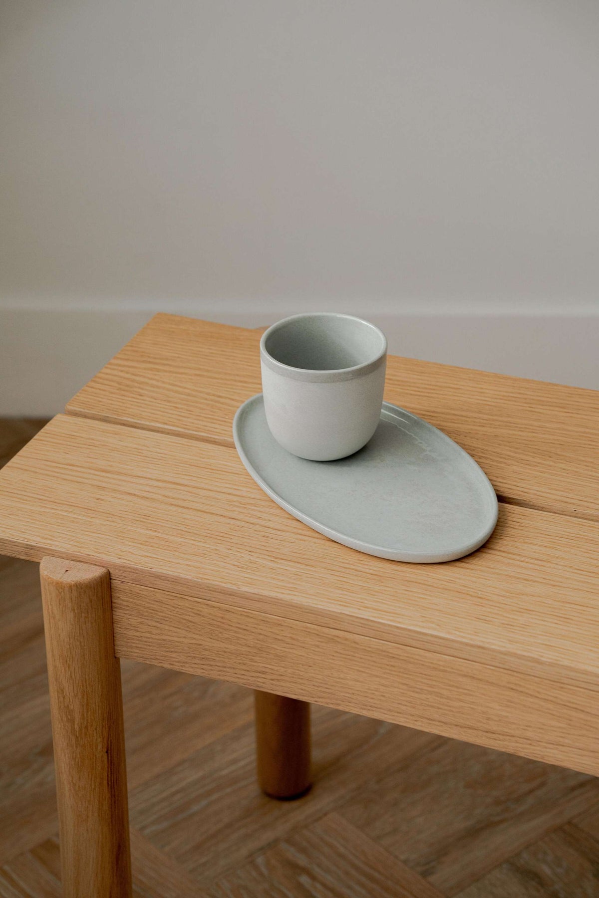 Handmade porcelain coffee cup gray sky with shiny glaze and smooth polished finish