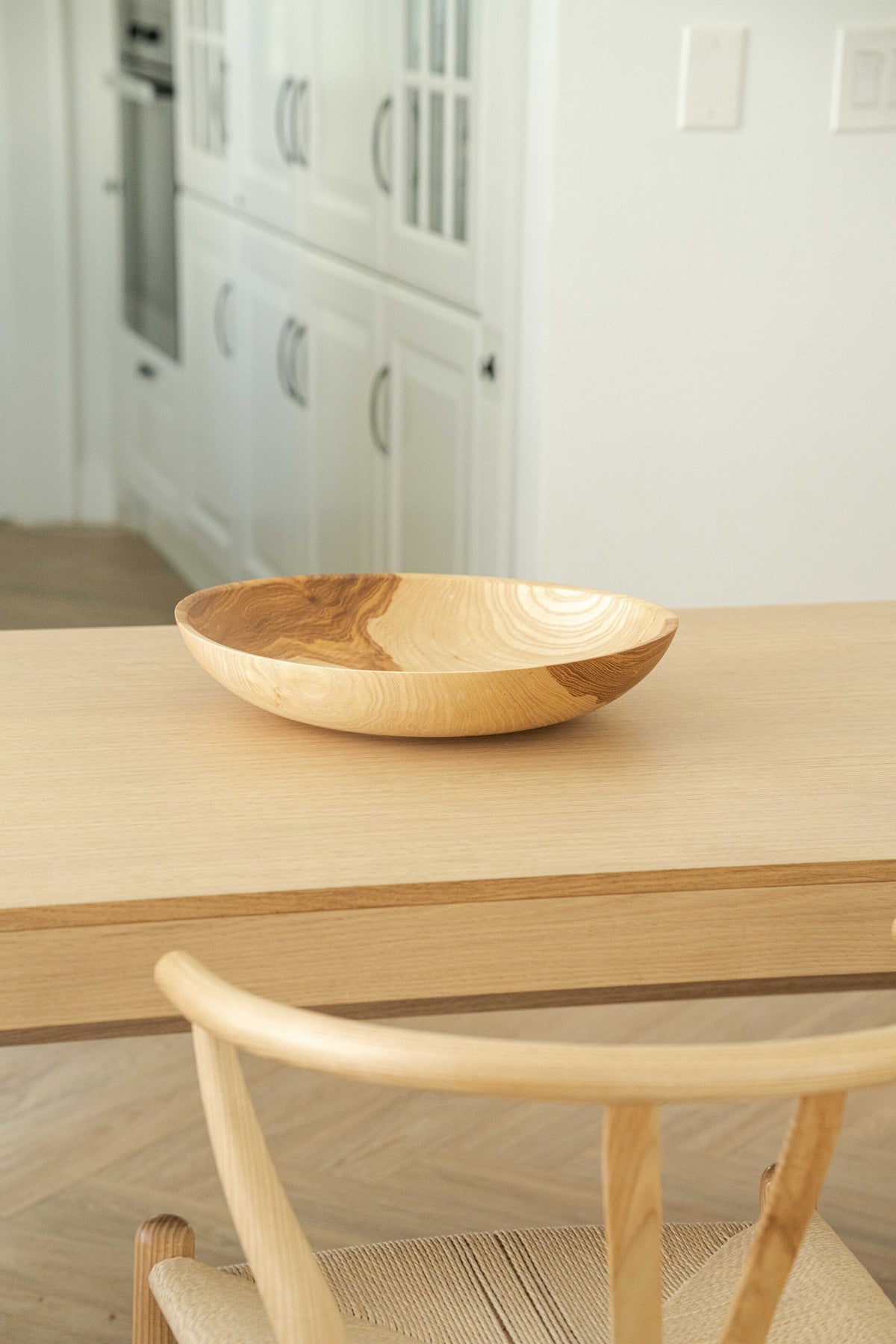 Hand-carved shallow ash wood fruit bowl with natural gradient, 16-inch diameter, handmade in Ukraine