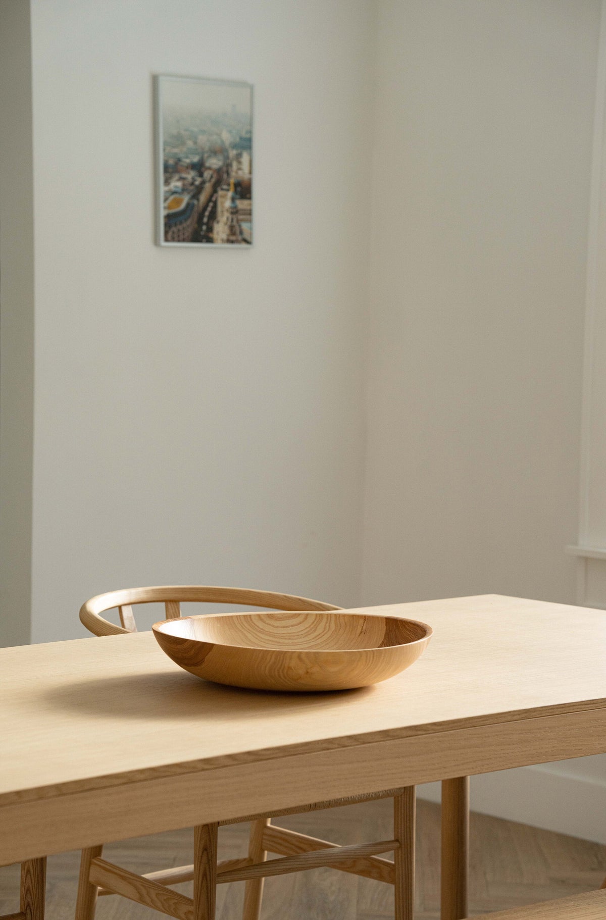 Hand-carved shallow ash wood fruit bowl with natural color gradient and 16-inch diameter
