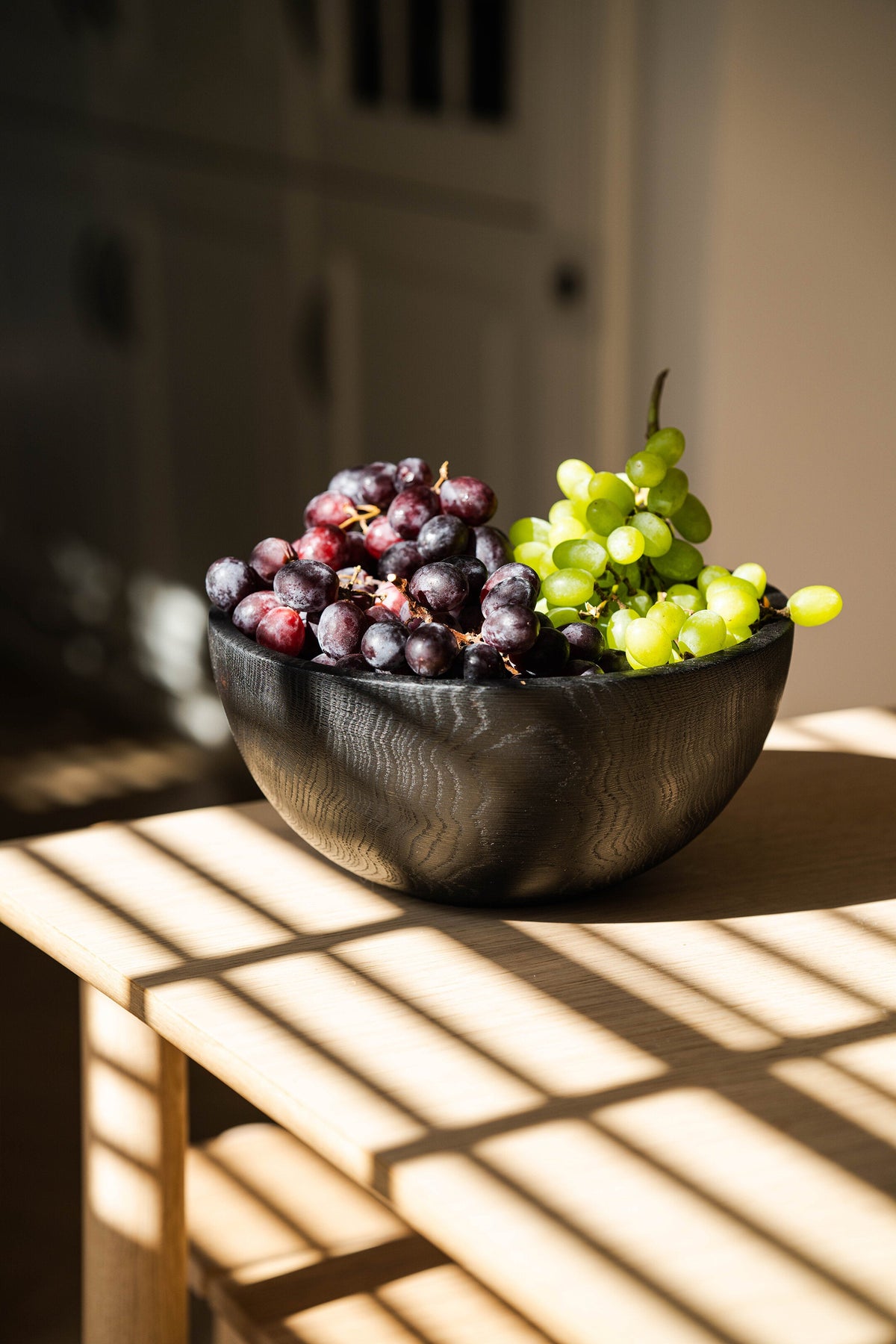 Hand carved large half charred wooden bowl with natural texture and food-safe finish