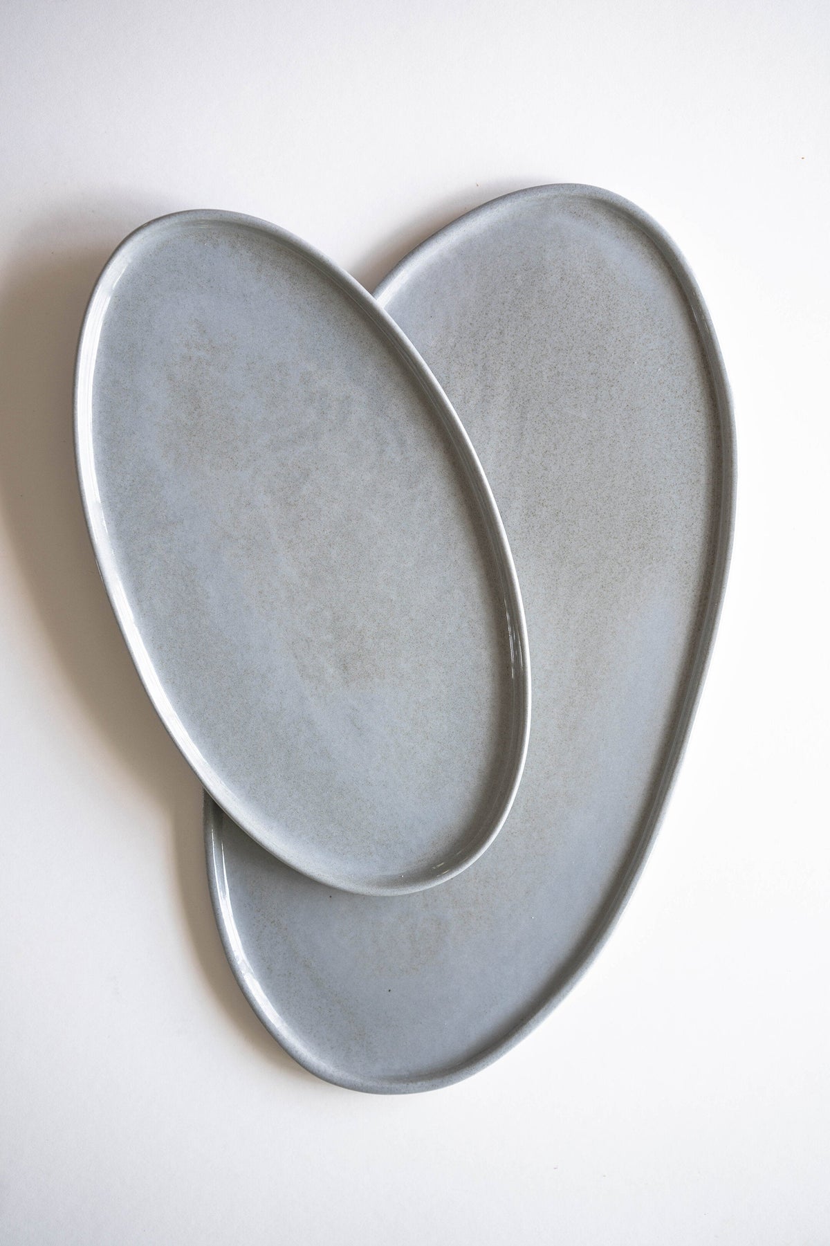 Handmade porcelain oval serving platter in gray sky color with organic edges