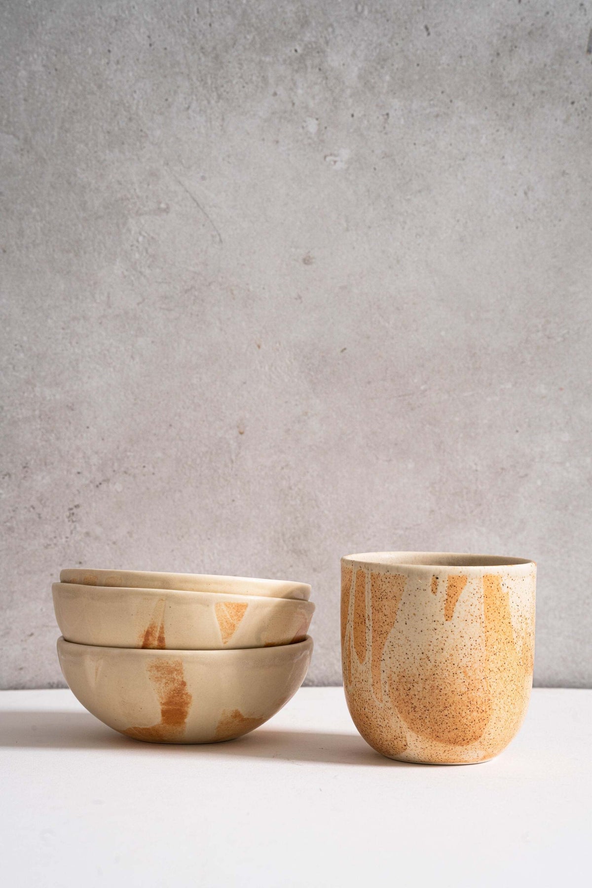 Beige matte stoneware bowl with unique rust-colored glaze, handmade in Ukraine, dishwasher and microwave safe