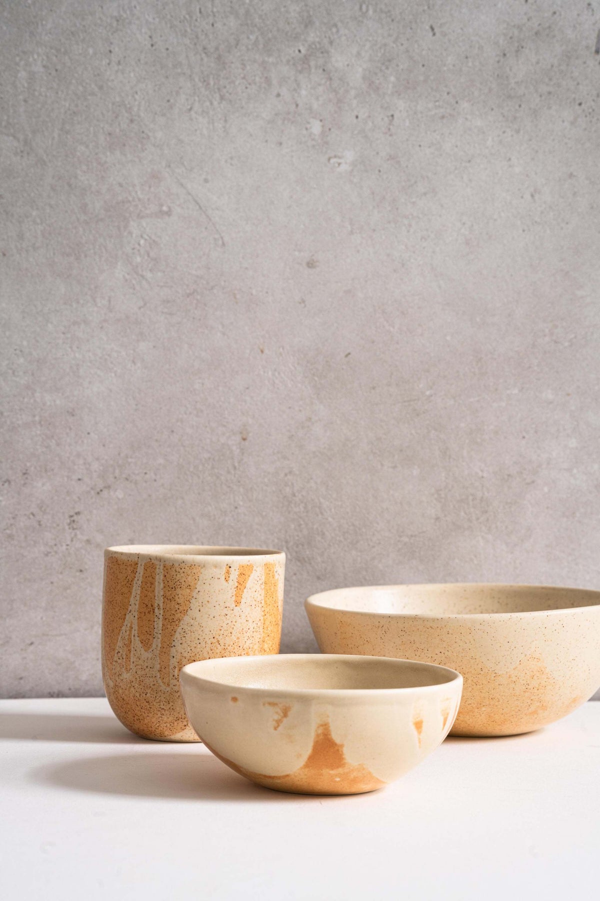Beige matte stoneware bowl with unique rust-colored glaze, handmade in Ukraine