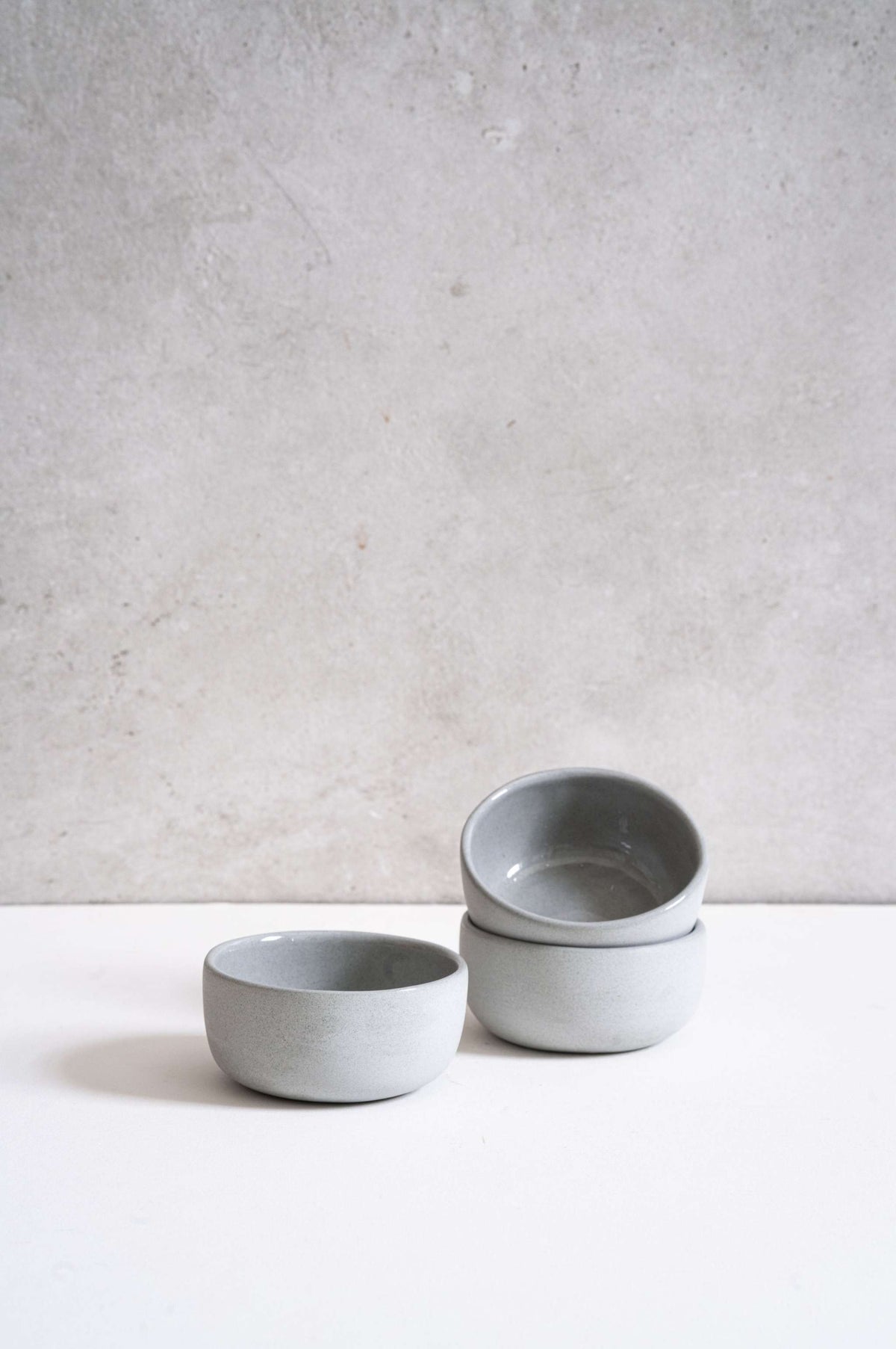 Handmade porcelain pinch bowl in gray sky color, deep sauce bowl for condiments, food-safe and dishwasher safe.