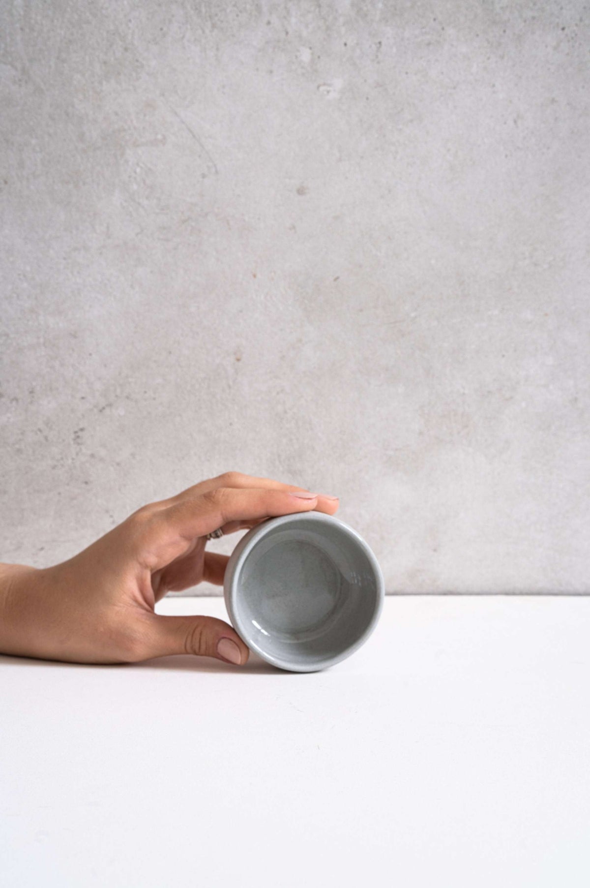 Handmade gray porcelain pinch bowl for serving condiments, unique and food-safe, made in Ukraine