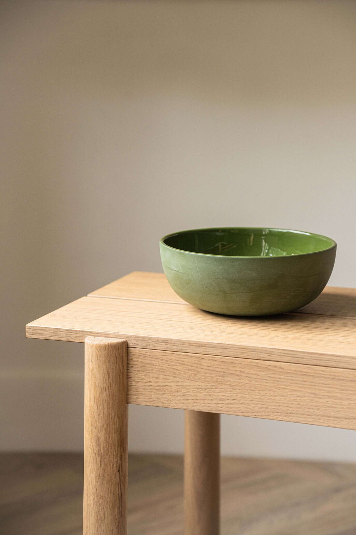 Green handmade porcelain salad bowl with matte exterior and glossy interior, perfect for salads and soups