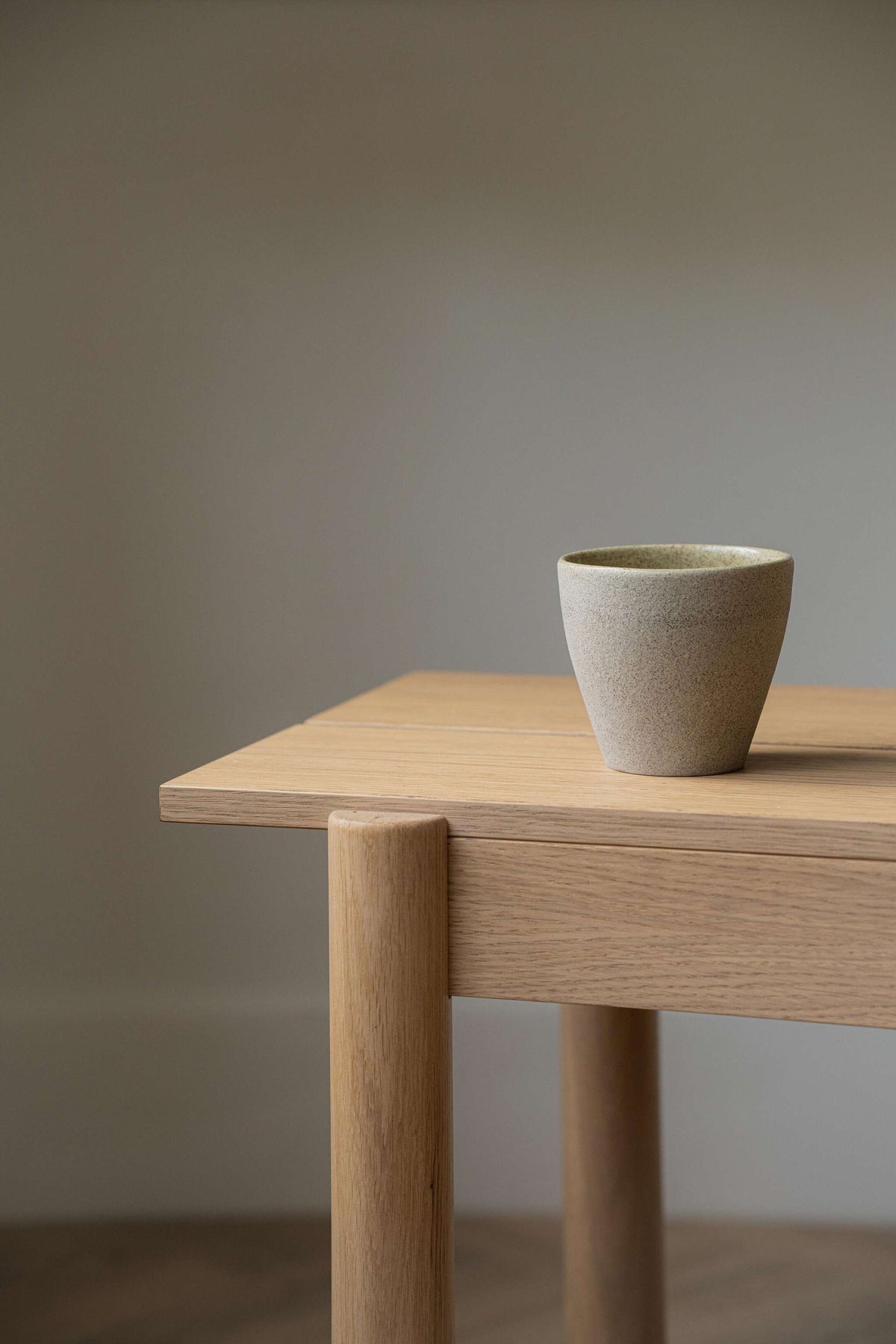Stoneware coffee mug with concrete-like texture, glossy interior, handmade in Ukraine, dishwasher safe
