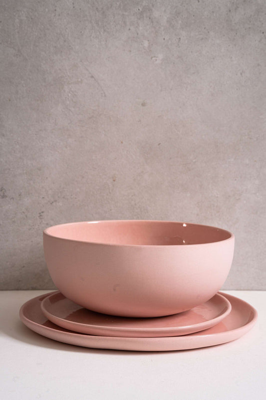 Handmade porcelain salad serving bowl in powder pink with shiny glazed interior and smooth polished exterior