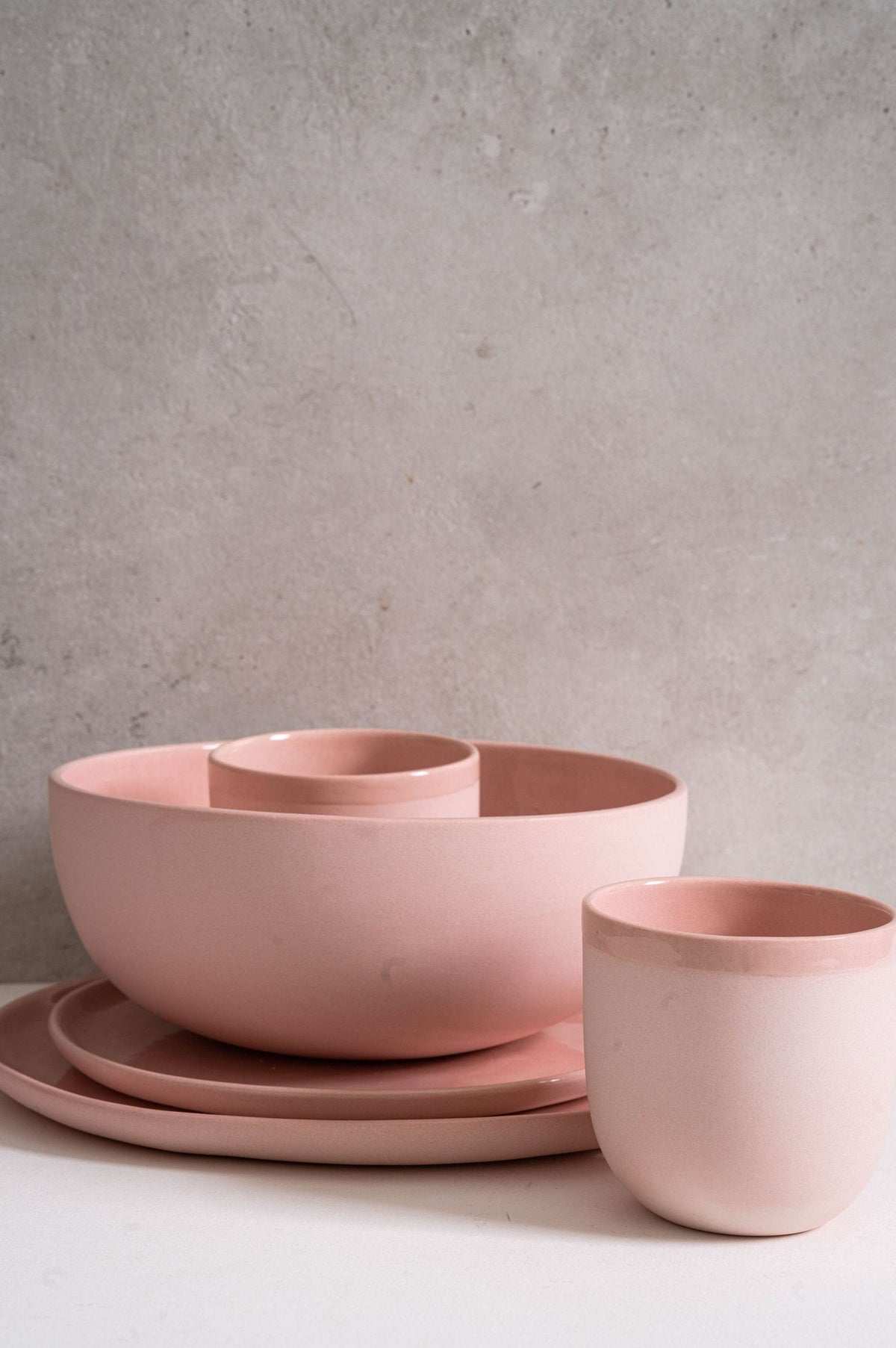 Set of handmade porcelain dinner plates in powder pink with glossy food-safe glaze