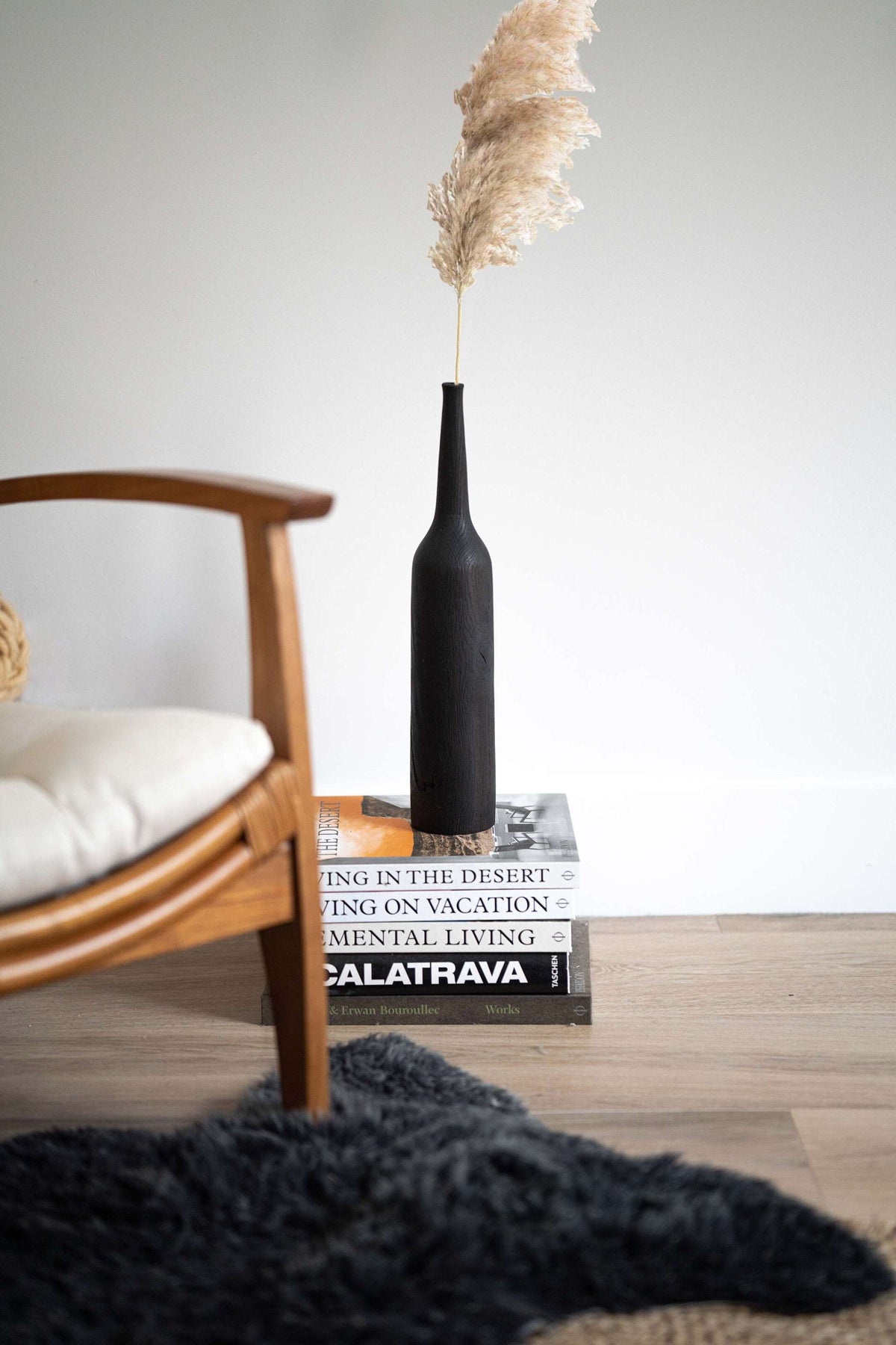 Tall charred oak wood vase with sharp shoulders and long neck, handcrafted in Ukraine.