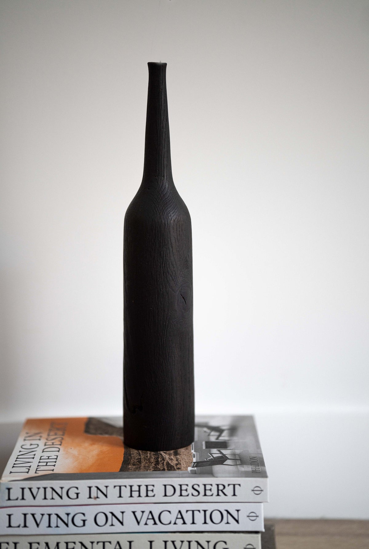 Tall charred oak wood vase with sharp shoulders and long neck, handcrafted in Ukraine.