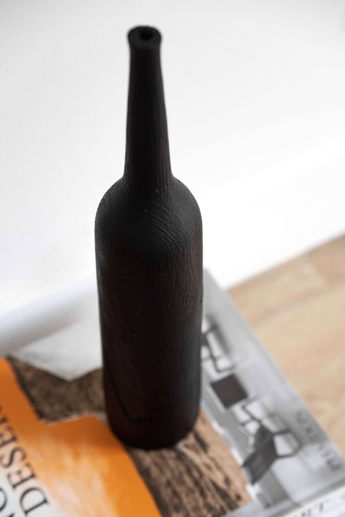 Tall charred oak wood vase with sharp shoulders and long neck, handcrafted in Ukraine