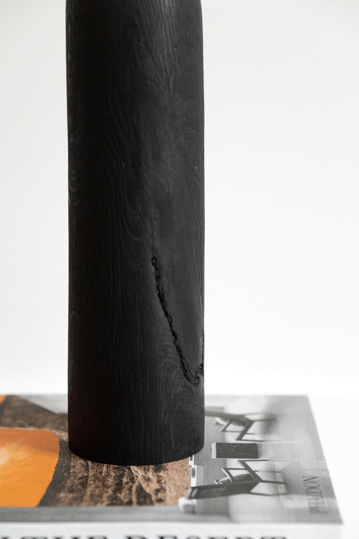 Tall charred oak wood vase with sharp shoulders and long neck, handcarved and rustic modern design