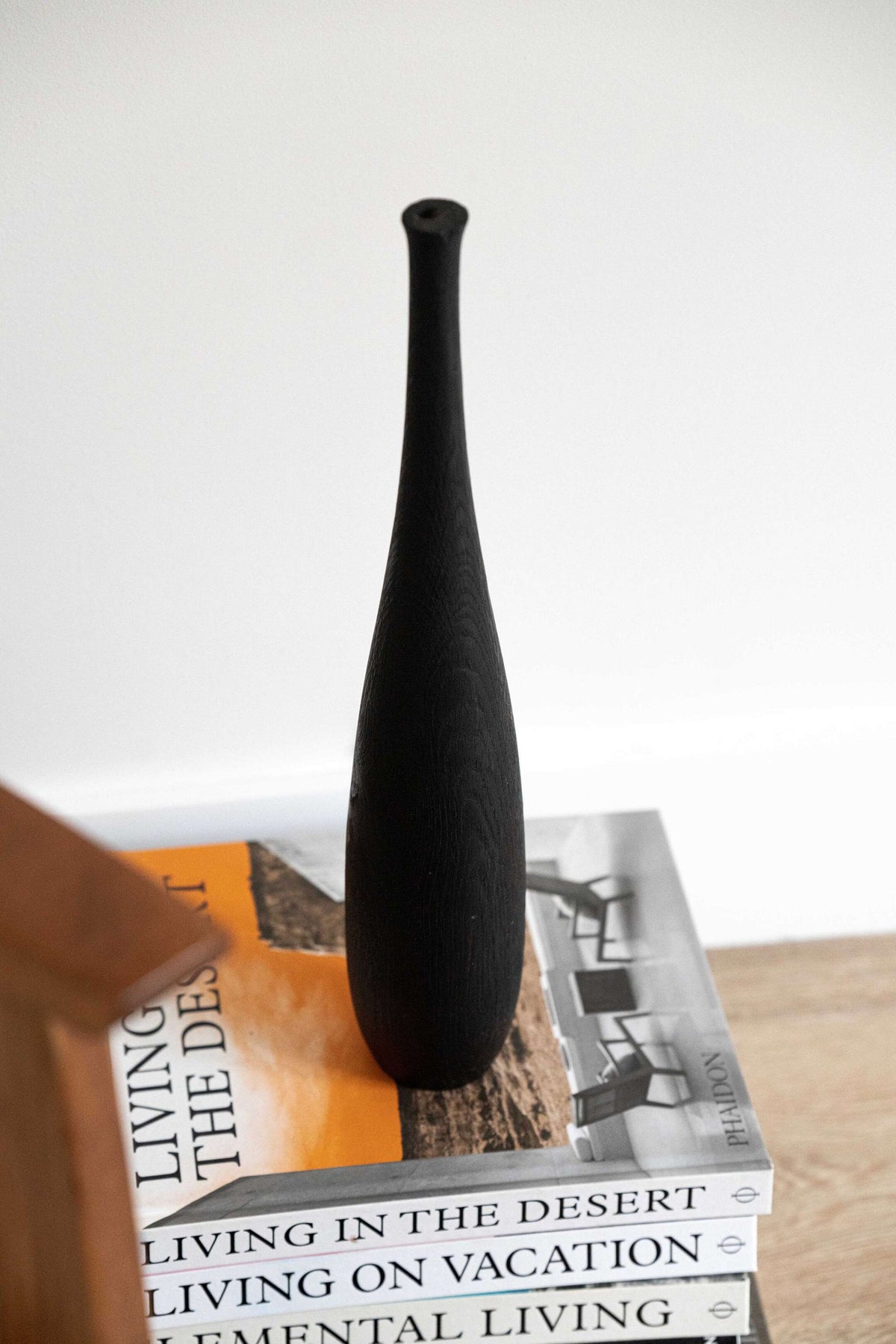 Tall charred wood vase with sharp shoulders and long neck, handcarved oakwood, rustic modern design