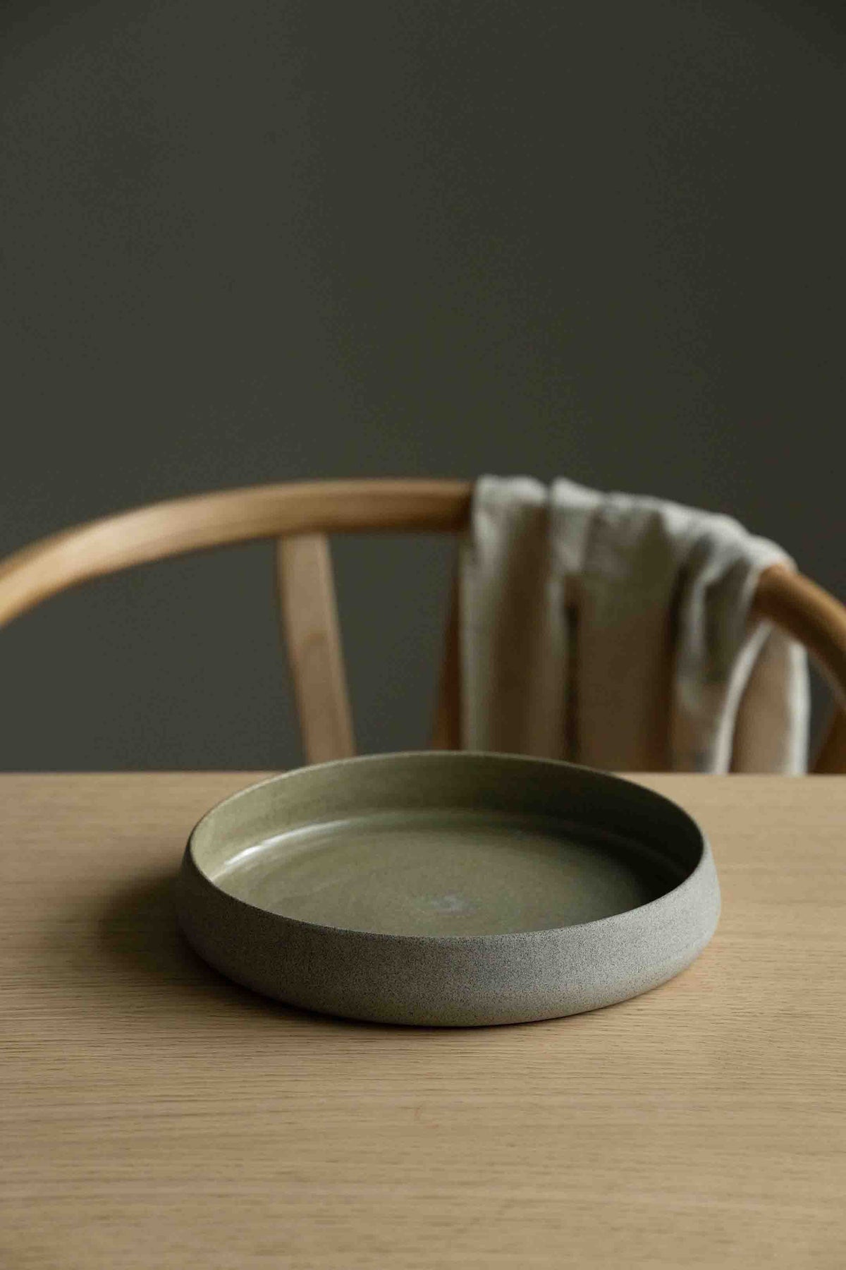 Handmade Concrete Stoneware Dinner Set with plates, bowl, and coffee cup showing matte exterior and glossy interior textures