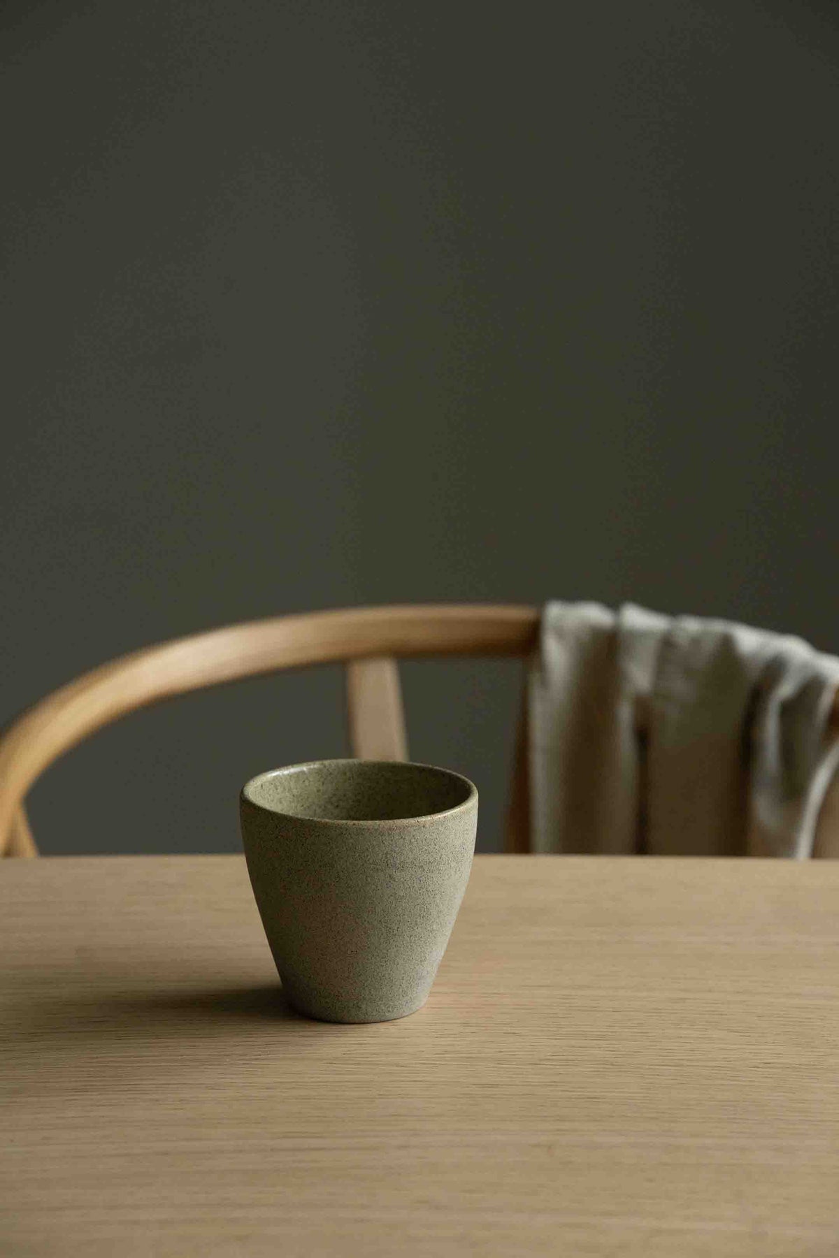 Handmade stoneware dinner set with matte exterior and glossy interior, including plate, salad plate, bowl, and coffee cup from the Concrete Collection