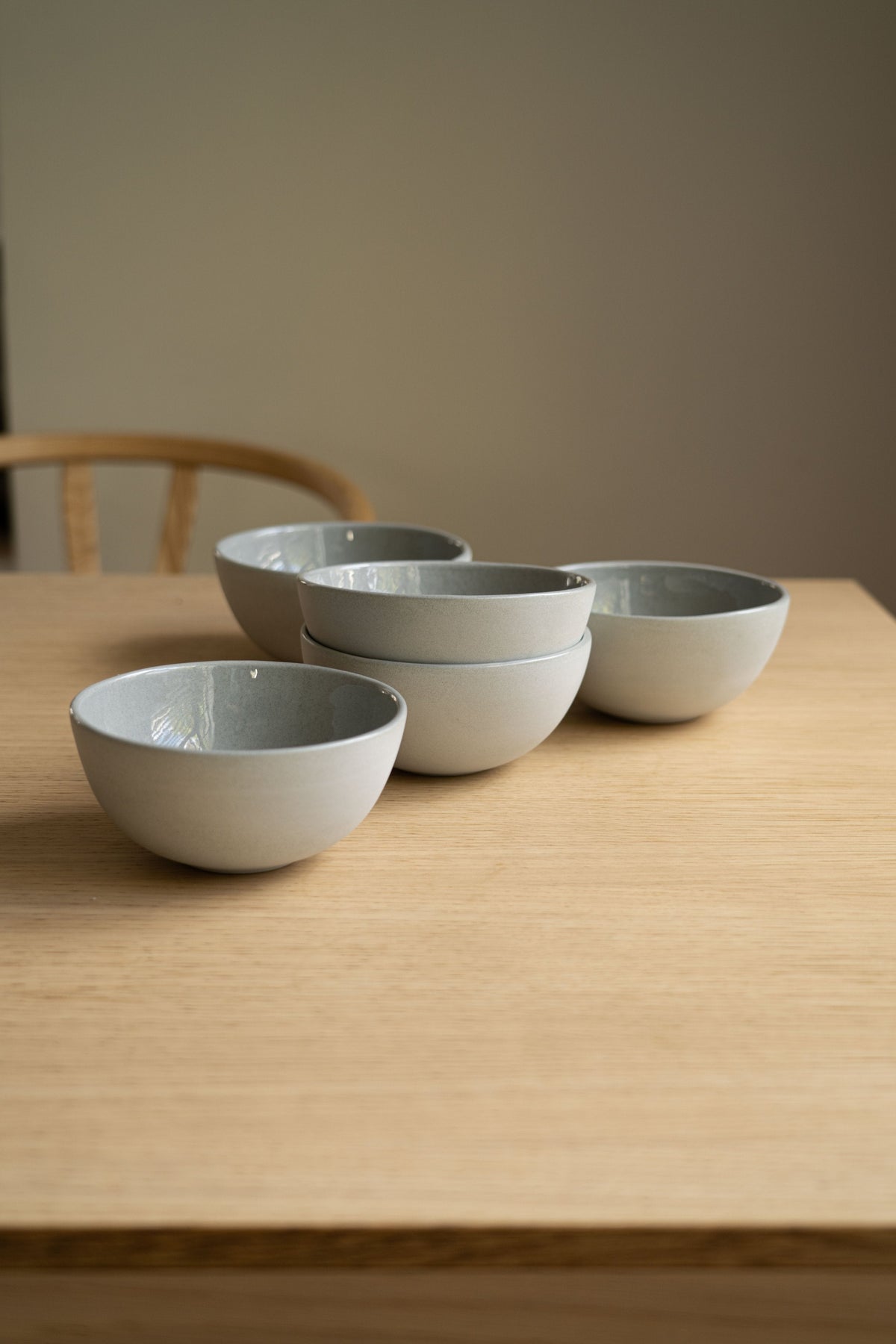 Handmade porcelain bowl in gray sky color with glossy glaze and smooth finish