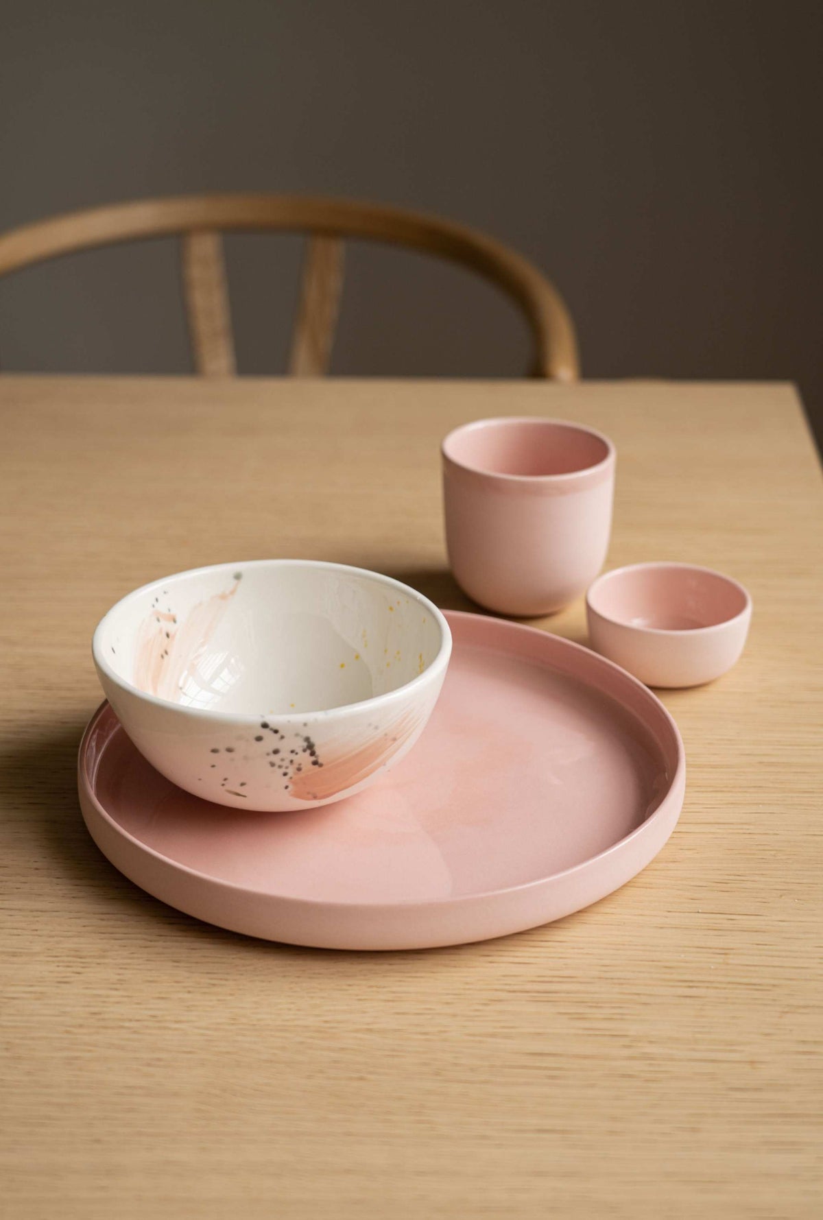 Handmade porcelain coffee cup in powder pink with glossy interior and smooth polished exterior, dishwasher safe