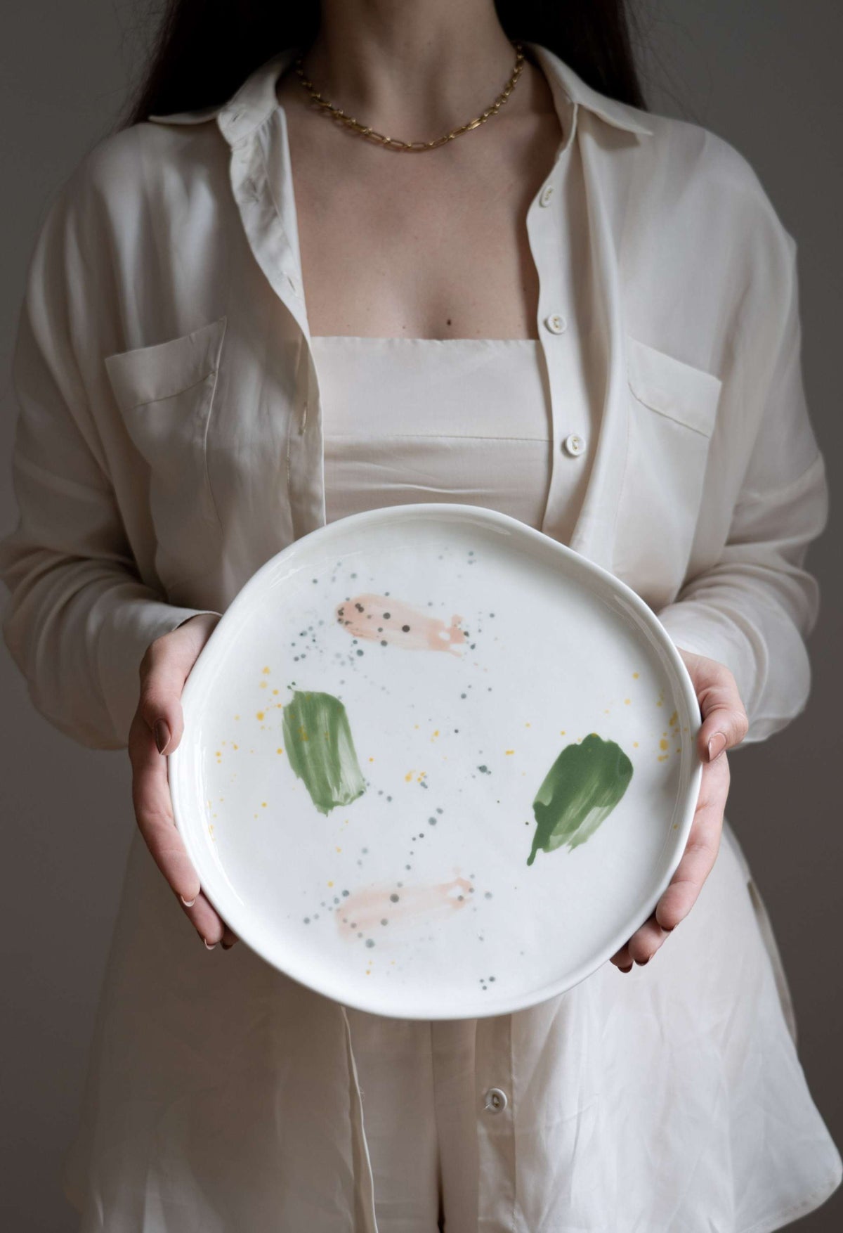 Handmade off-white porcelain dinner plate with hand painted strokes, food-safe glaze, and shiny finish