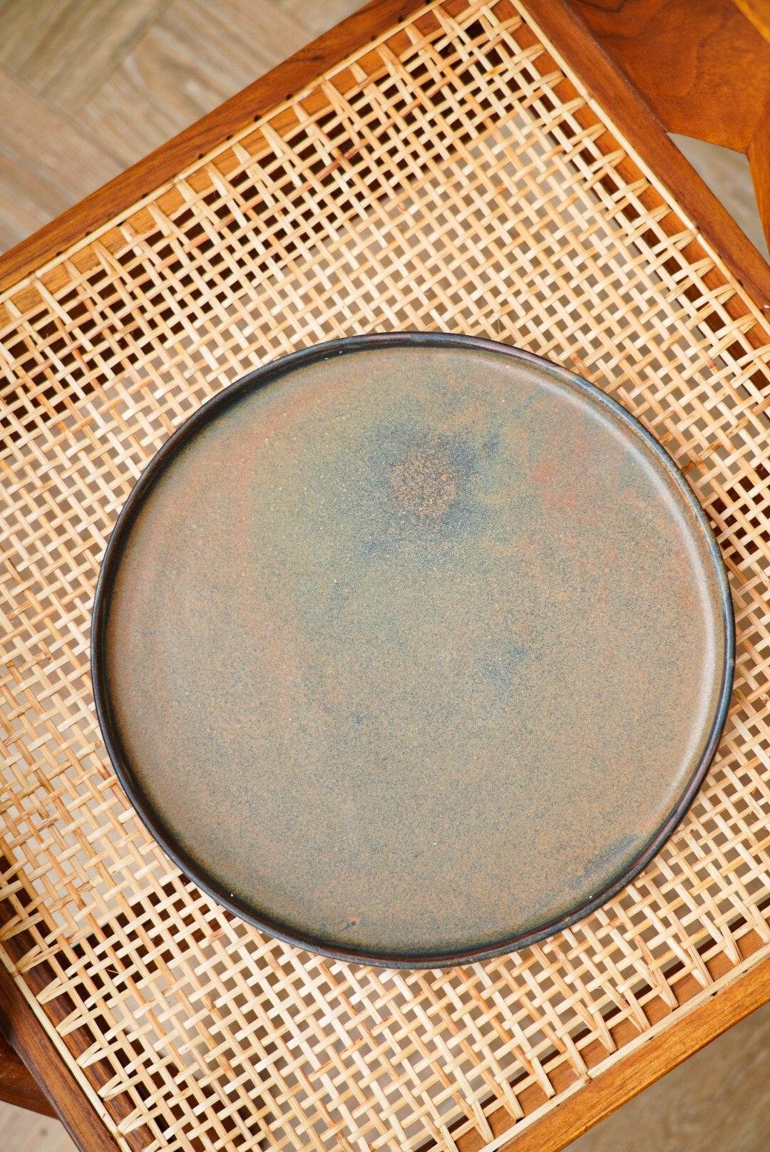 Matte brown-black rust dinner plates with unique reactive glaze swirl, low rim, handmade stoneware from Ukraine