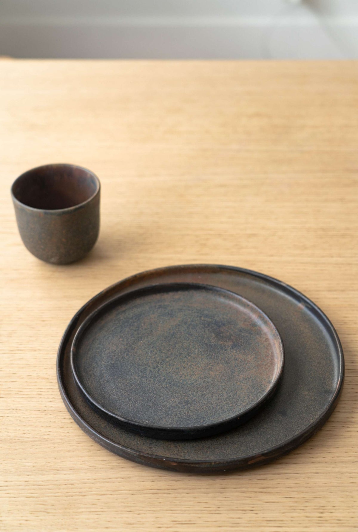Matte brown-black rust stoneware dinner plates with reactive glaze, handmade in Ukraine