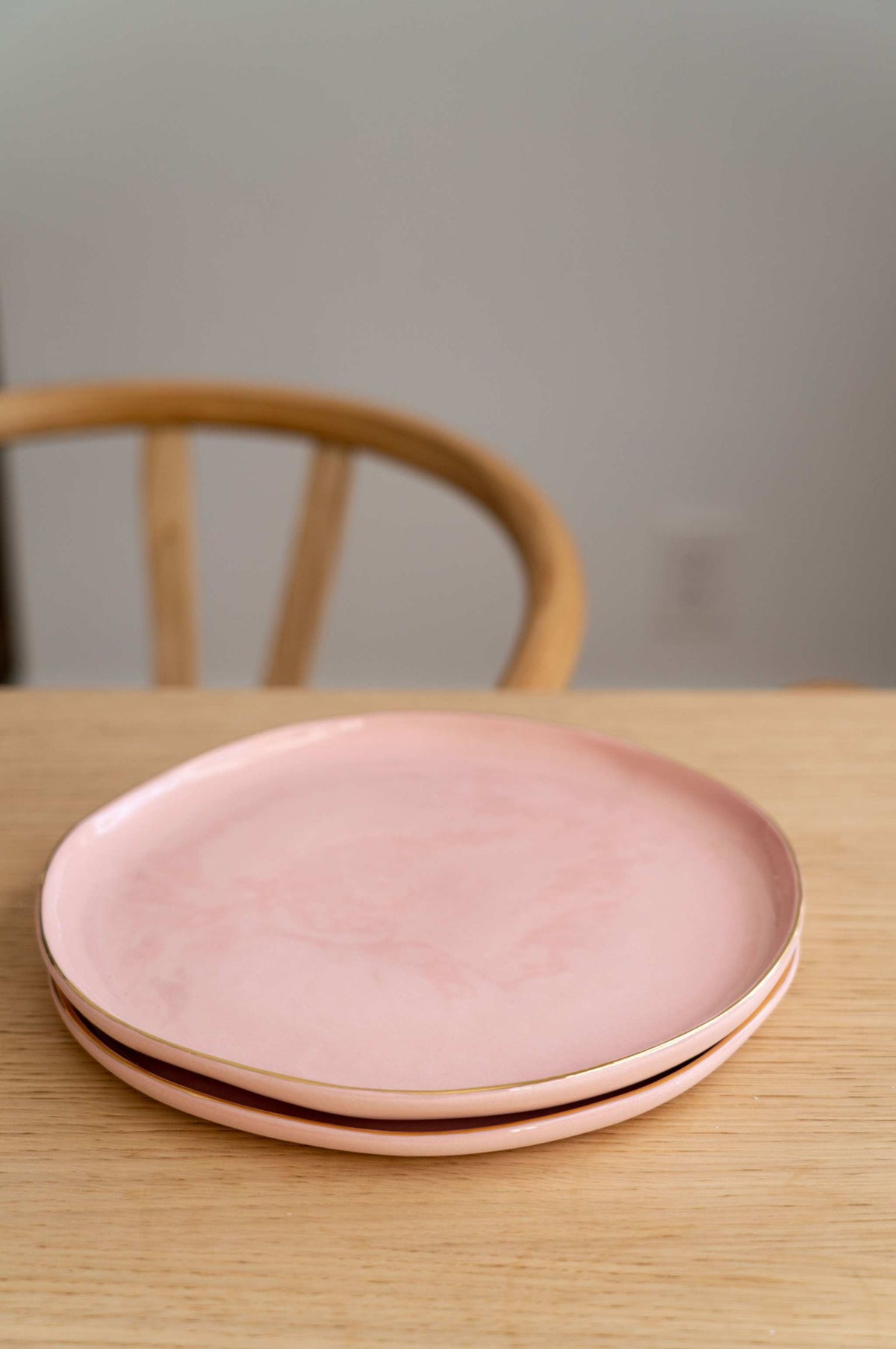 Handmade porcelain powder pink dinner plates with gold rim, elegant and glossy finish