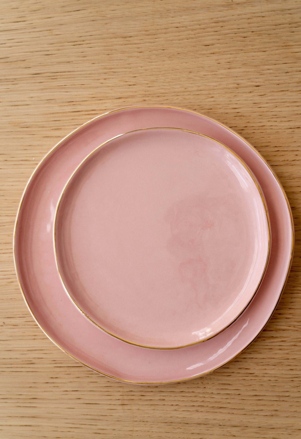 Handmade porcelain dinner plates powder pink with gold rim and shiny glaze