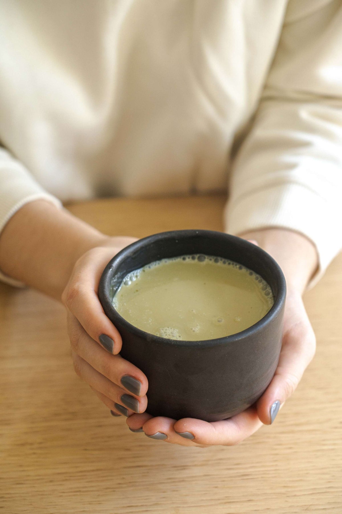 Stoneware black matcha bowl with sharp vertical sides, handmade, food-safe, and dishwasher safe