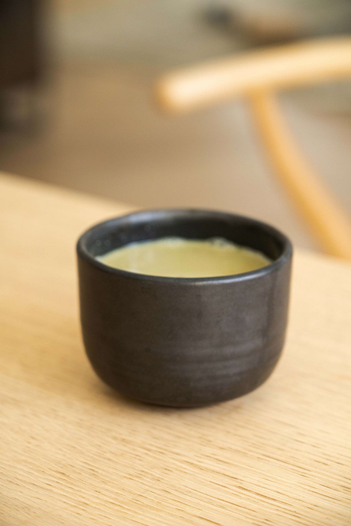 Stoneware black matcha bowl with sharp vertical sides for whisking, handmade in Ukraine