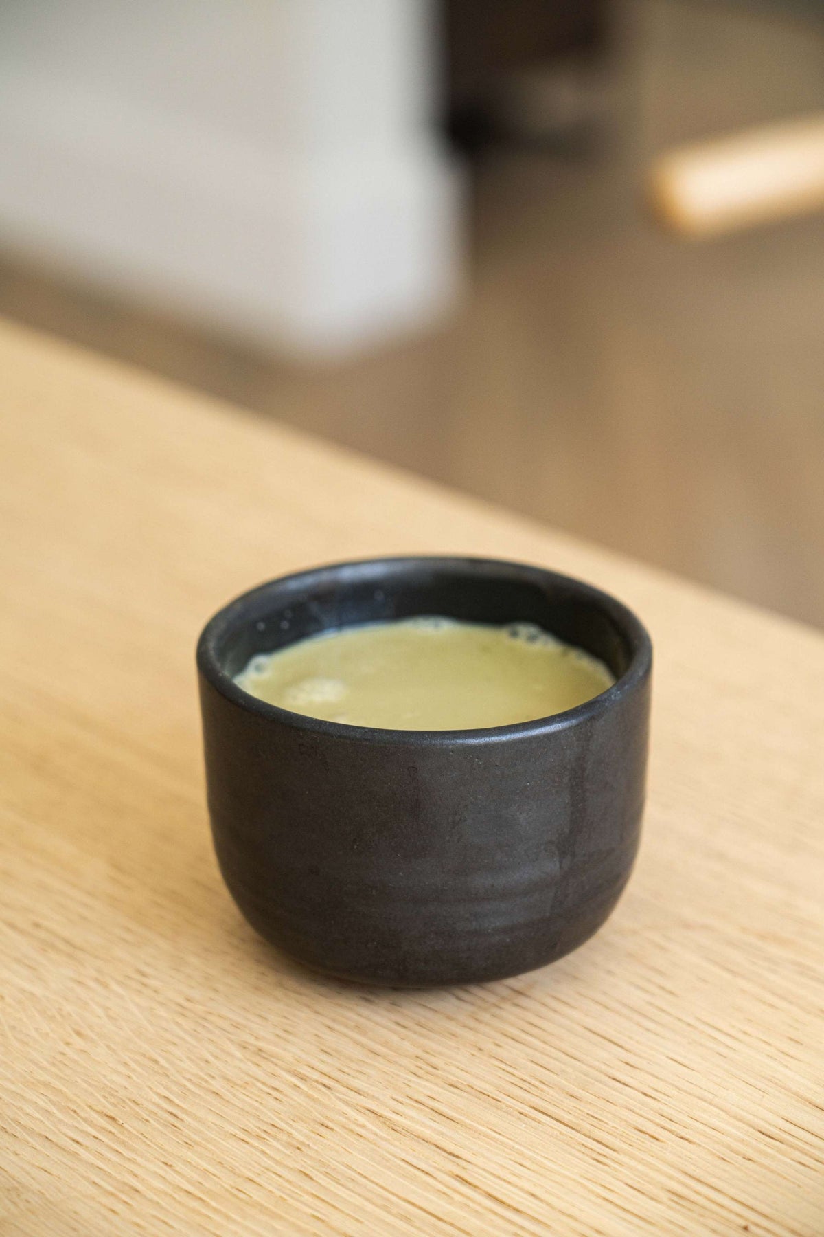 Handmade stoneware black matcha bowl with sharp vertical sides for whisking, dishwasher and microwave safe