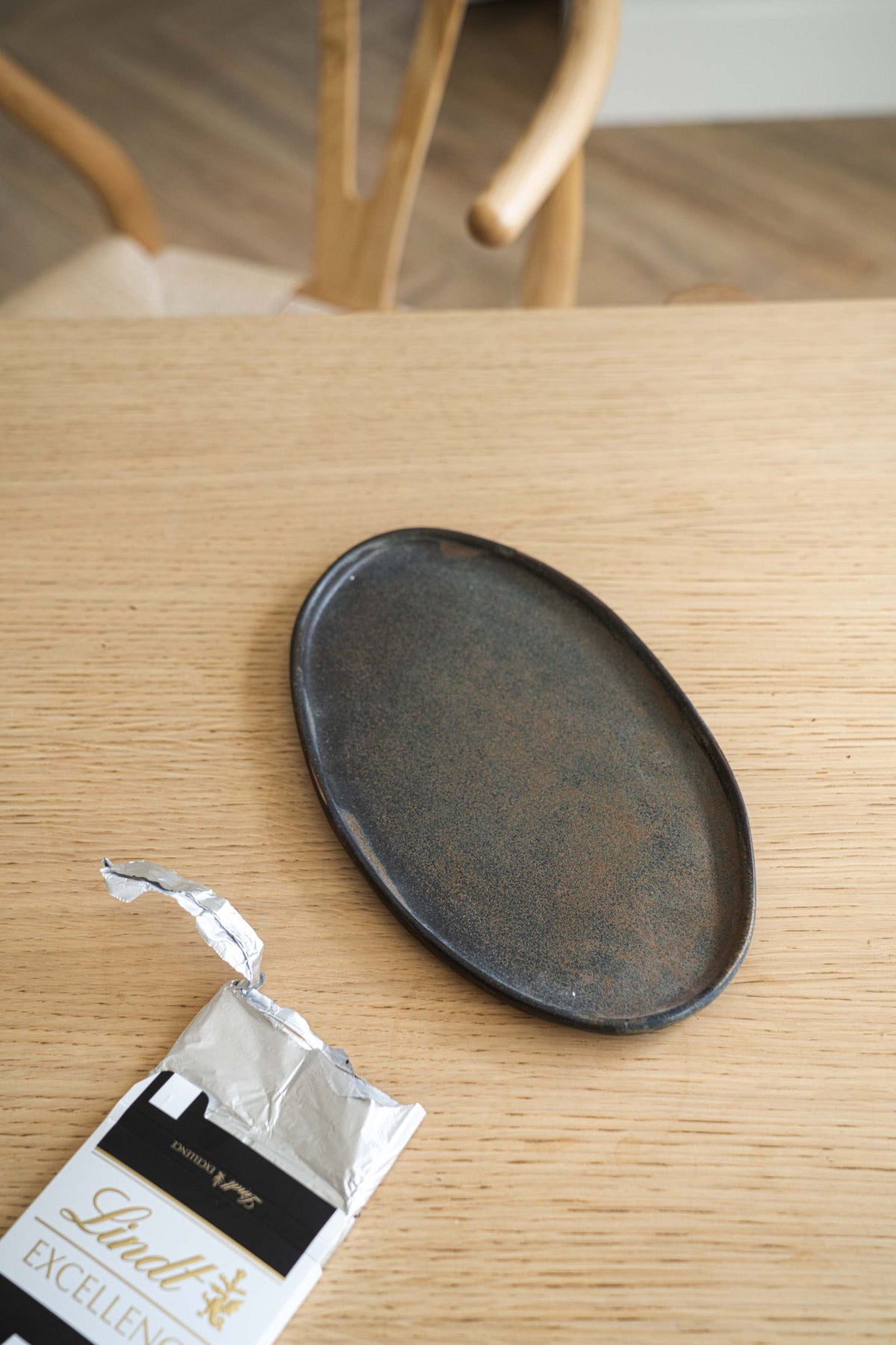 Rust matte stoneware serving platter with organic edges and reactive glaze, handmade in Ukraine.