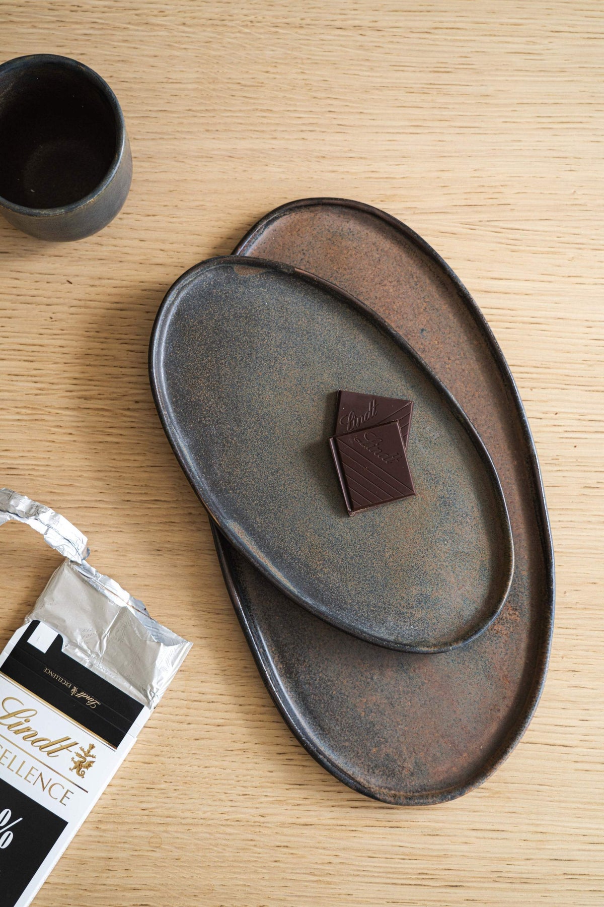 Rust matte stoneware serving platter with organic edges and reactive glaze, handmade in Ukraine