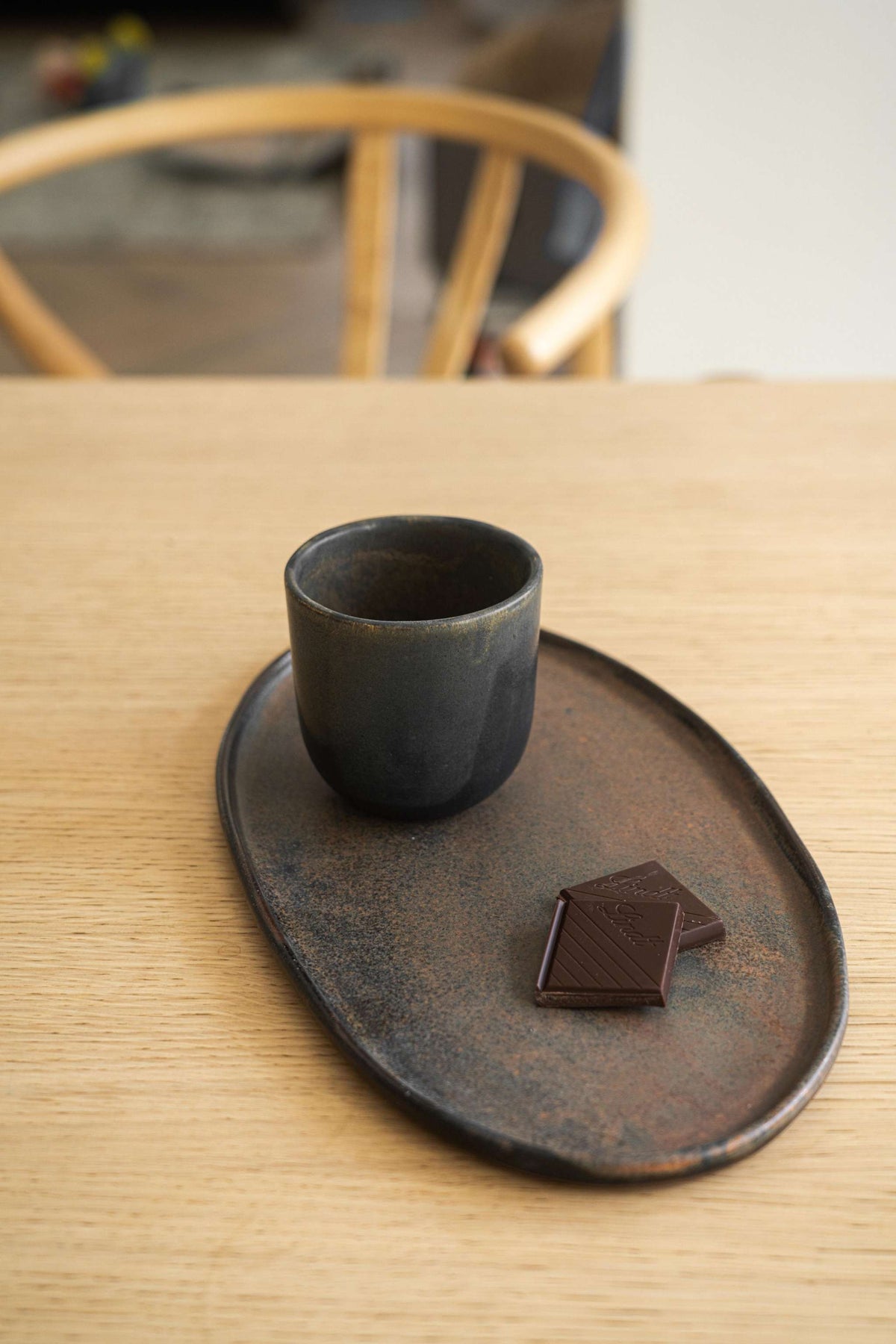 Rust matte stoneware serving platter with oval shape and organic edges, handmade in Ukraine