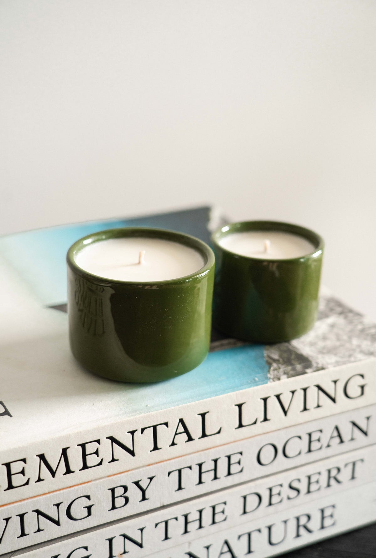 Handmade green porcelain candle with organic wax in refillable bowl
