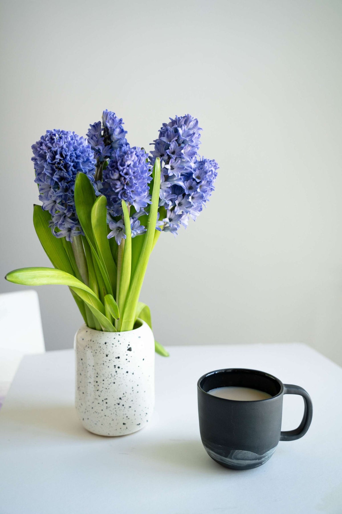 Handmade porcelain coffee mug with white swirl design inspired by Iceland, black color, food-safe glaze, dishwasher and microwave safe, crafted in Ukraine