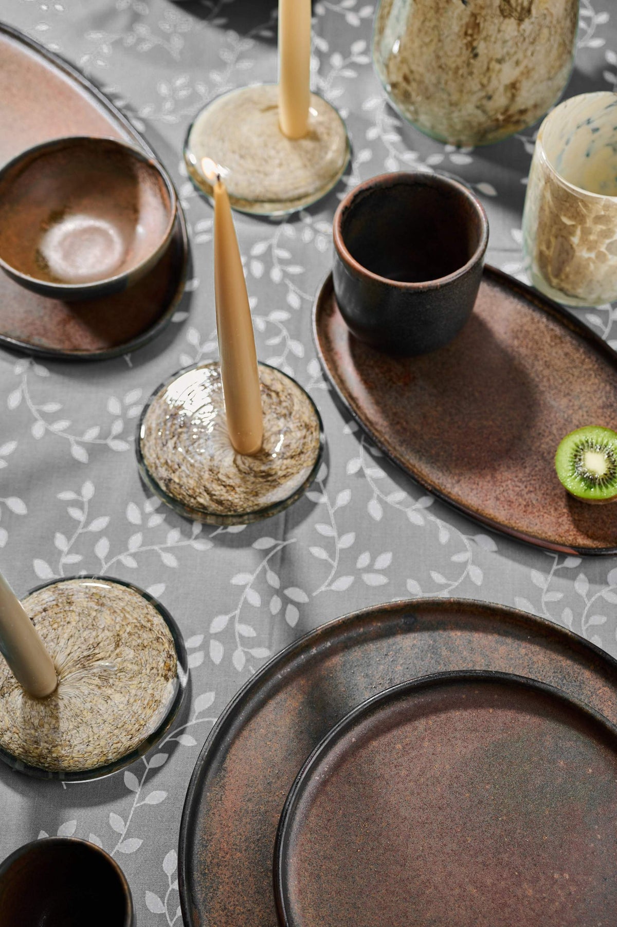 Hand blown glass candle holder with marble-inspired design and rounded shape, unique artisanal piece from Ukraine
