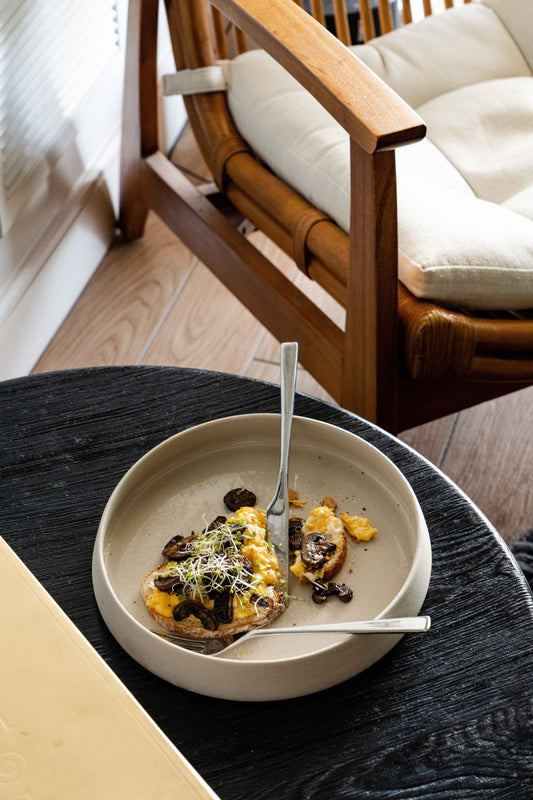 Handmade stoneware dinner plates with high sides and transparent glaze, rustic texture and glossy interior