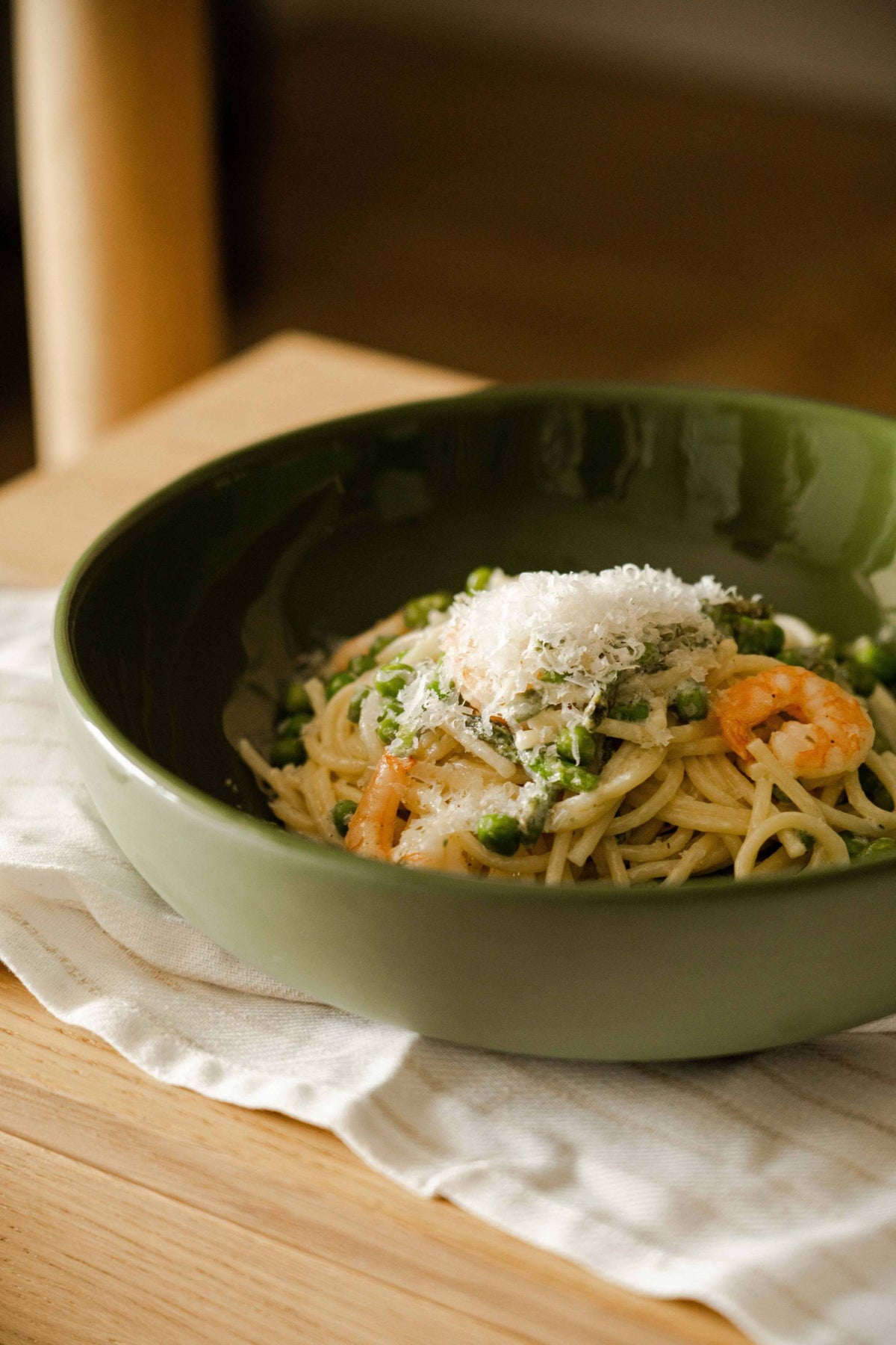 Handmade green porcelain pasta bowl with glossy glaze and high sides, made in Ukraine