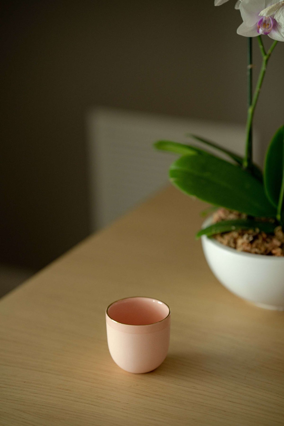 Handmade porcelain espresso cup in powder pink with gold rim and glossy interior