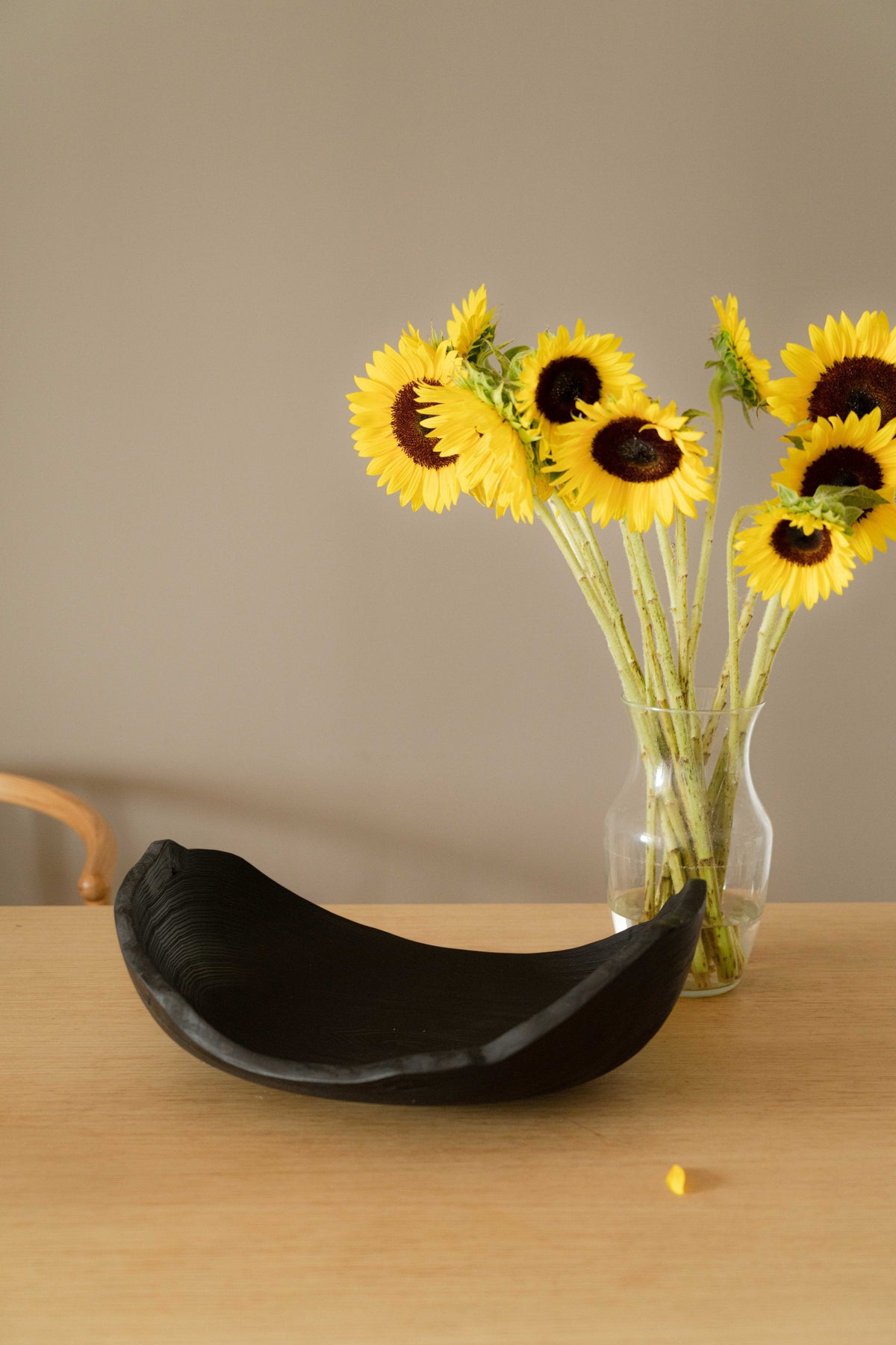Hand-carved large charred wood shallow bowl with ripped edges for fruits and vegetables