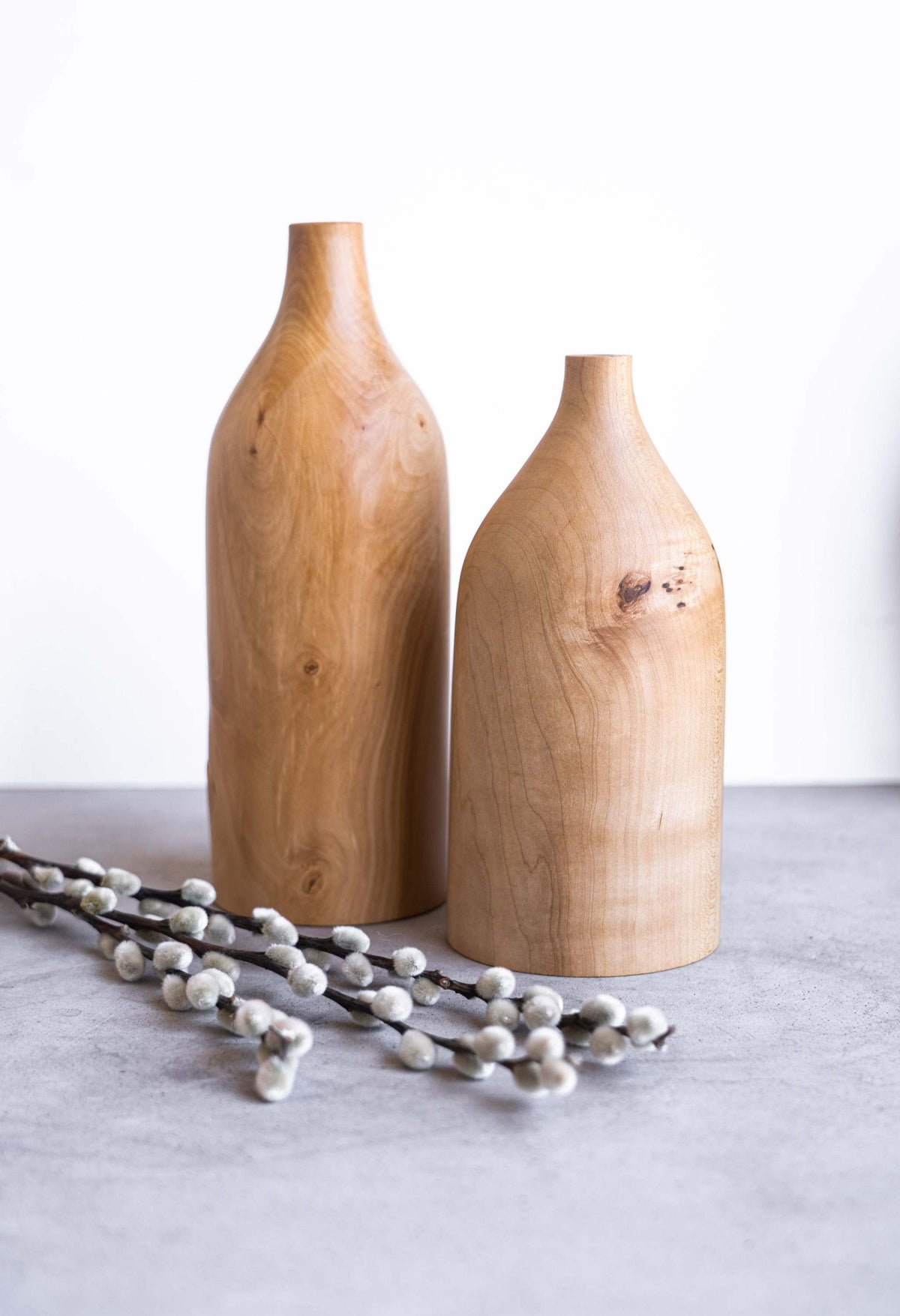 Handcrafted pear wood bottle-shaped vase with natural grain and smooth finish
