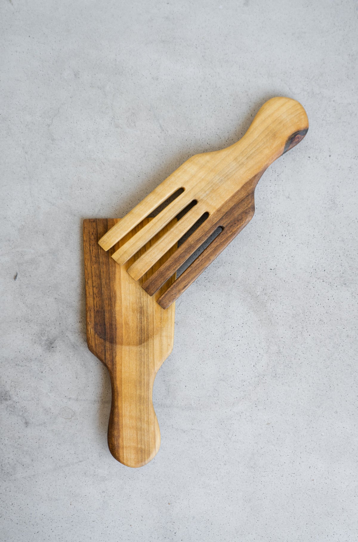 Two-piece walnut wood salad serving set with polished handles and straight heads handcrafted in Ukraine