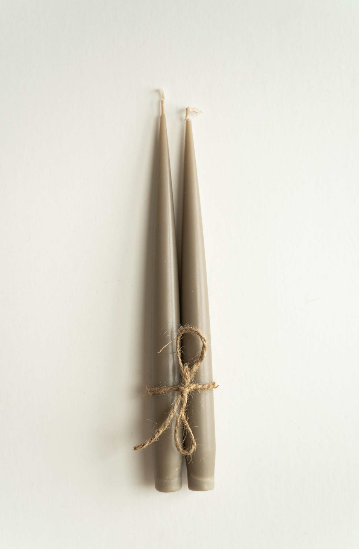Set of handmade narrow taper candles in glass holders, made from soy wax with cotton wicks for long burn time
