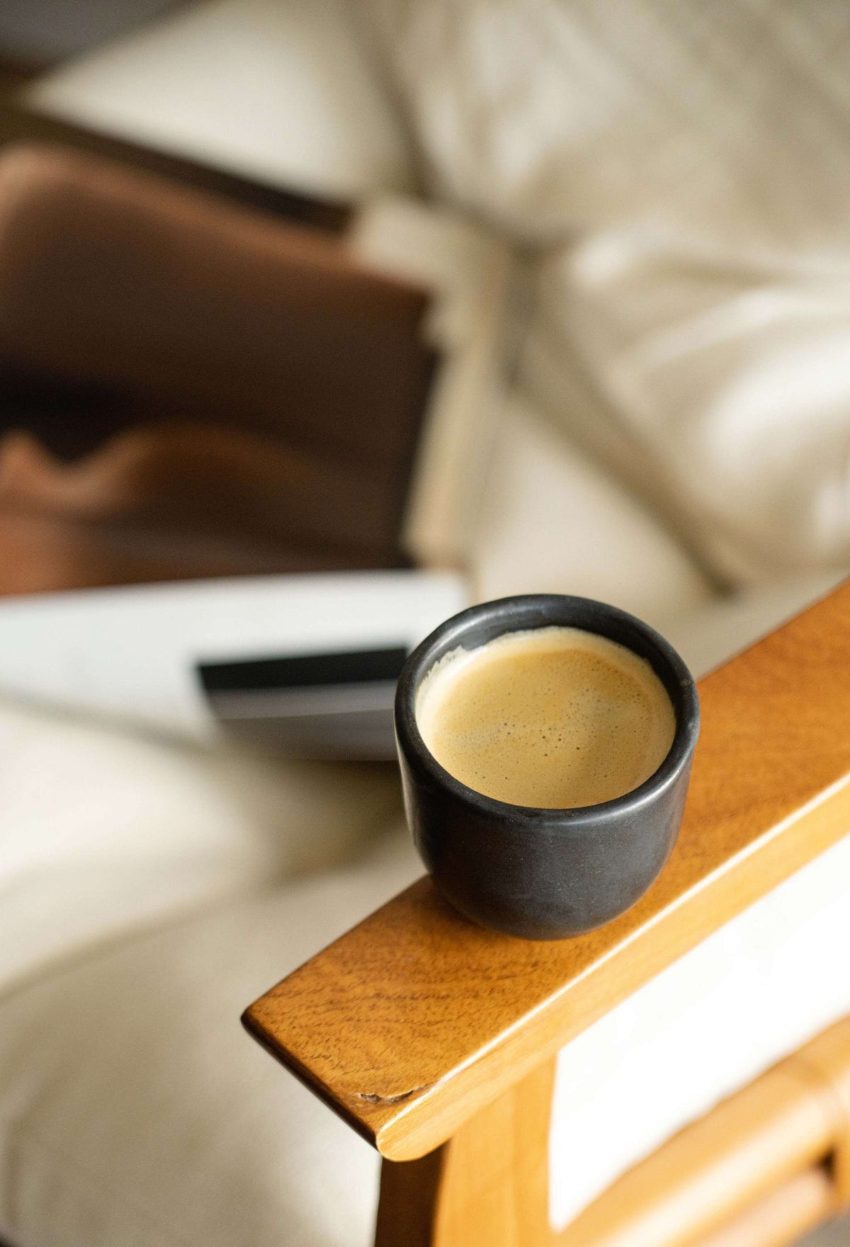 Handmade black stoneware espresso cup with organic edges and reactive glaze, 5 oz, dishwasher and microwave safe