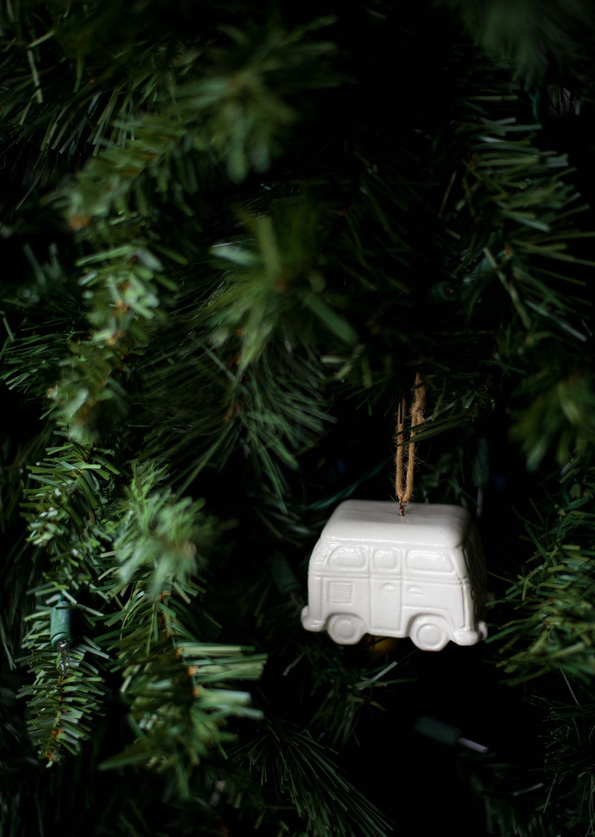 Handmade white porcelain Christmas ornaments with jute hanging loops, made in Ukraine