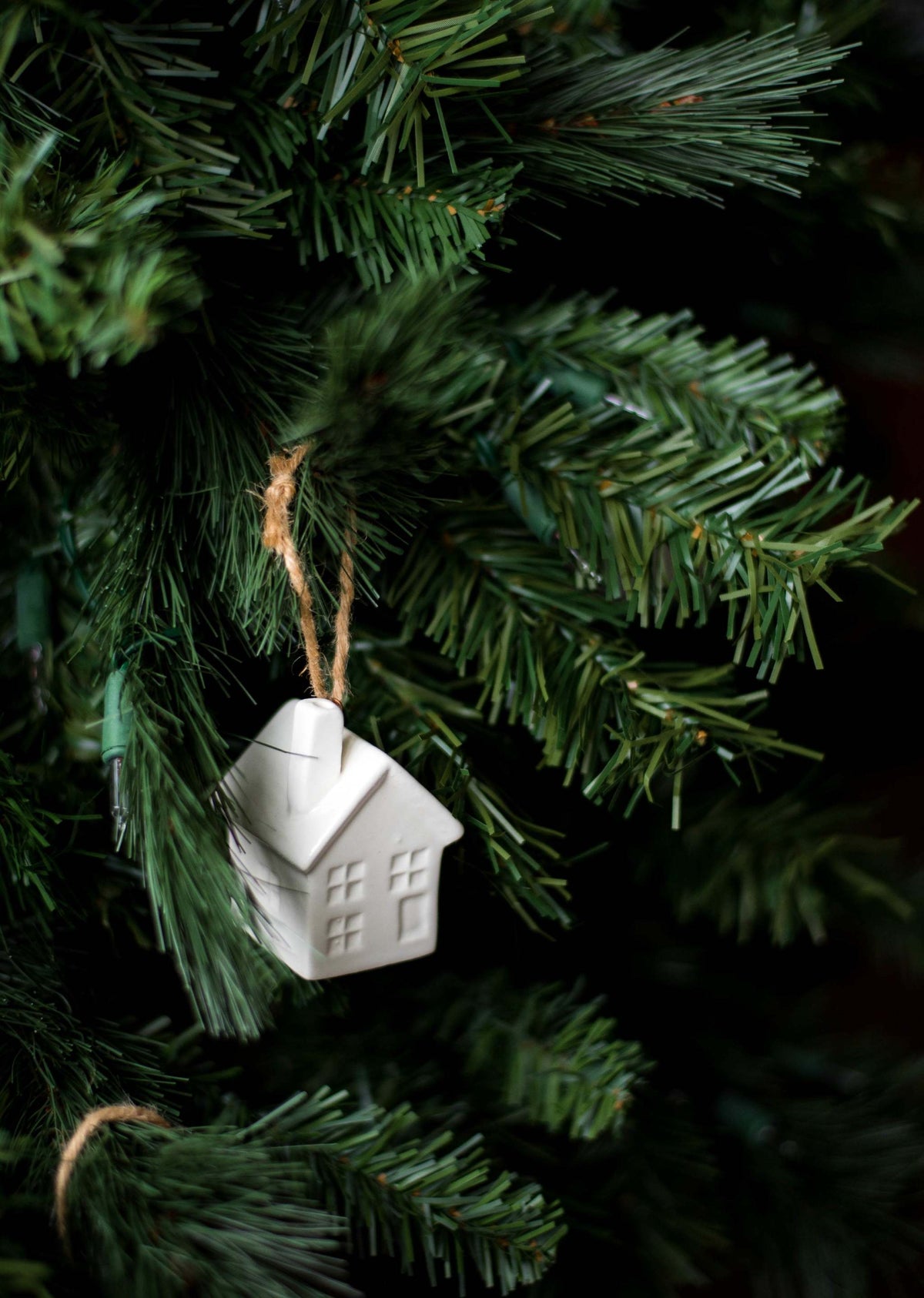 Handmade white porcelain Christmas ornaments with jute loops, rustic glazed design from Ukraine