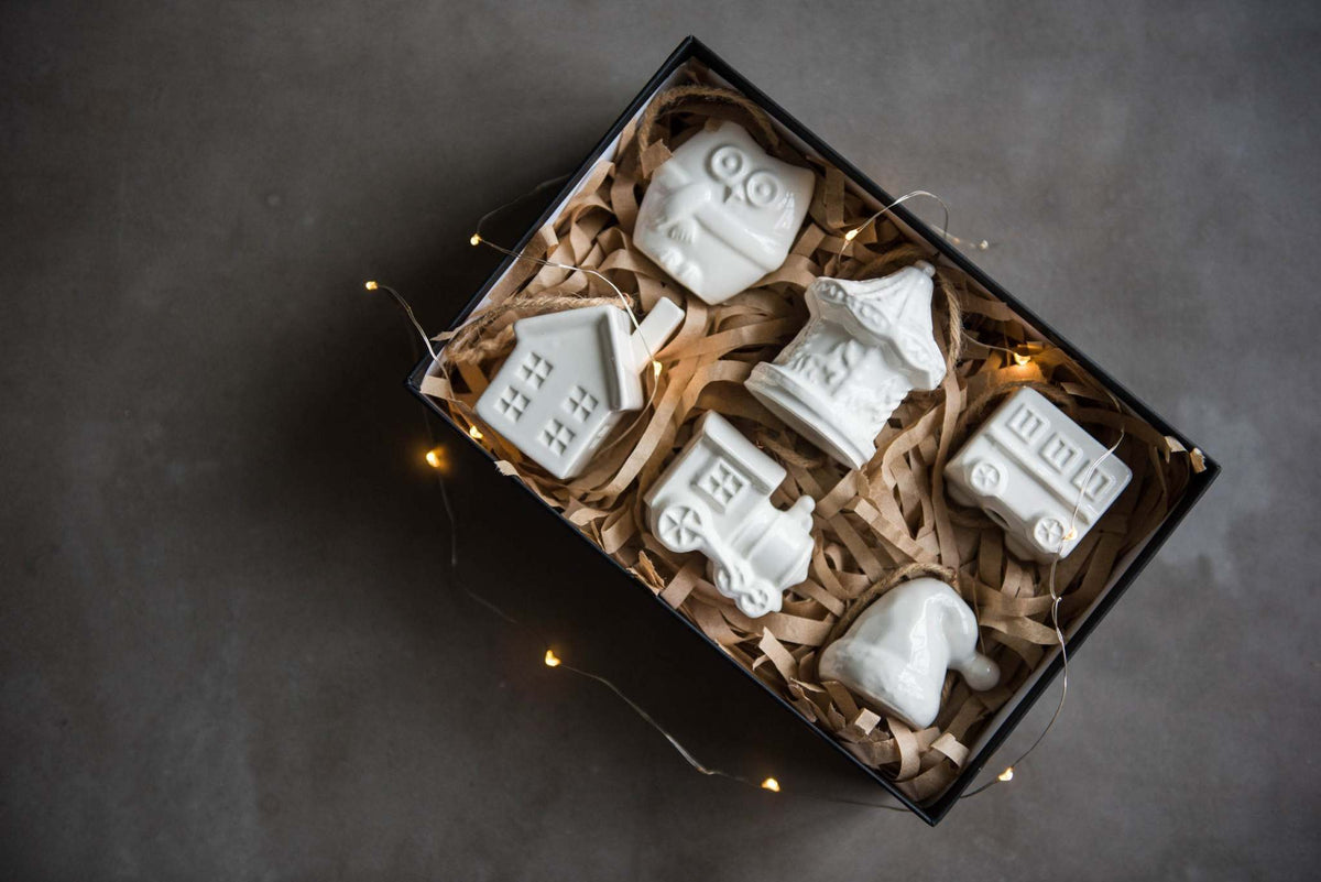 Handmade white porcelain Christmas ornaments with jute hanging loops, rustic holiday decor made in Ukraine