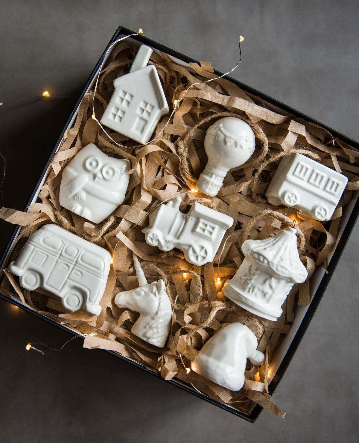 Handmade porcelain Christmas ornaments with jute hanging loops, white glazed finish, rustic holiday decor made in Ukraine