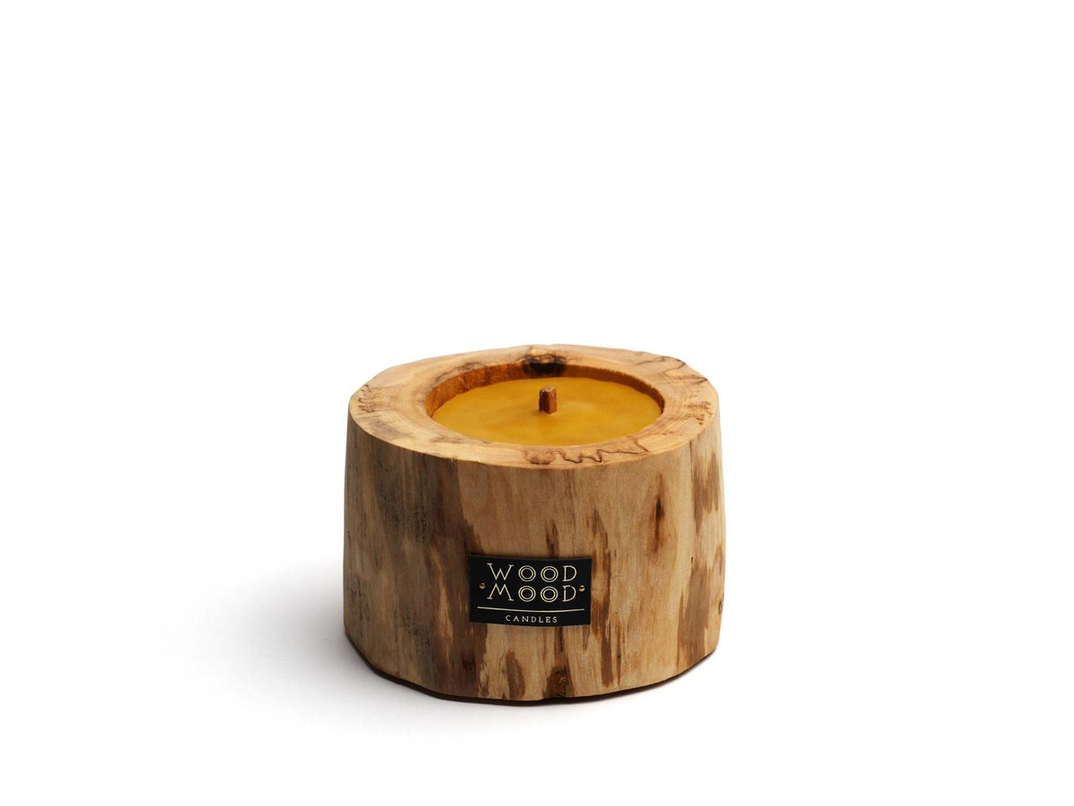 Hand Craft Ubud Wooden Candle in a natural brown charred wood holder, with a golden wax center and single wick.