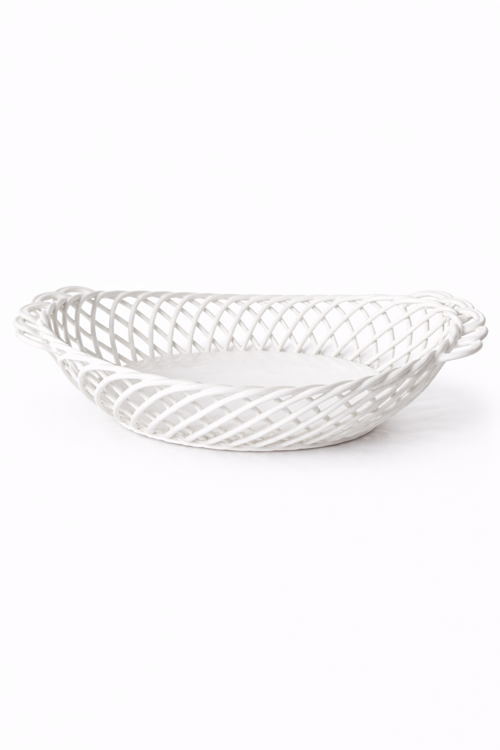 Ceramic Oval Basket in glossy white porcelain, with an airy hand-woven lattice design and oval shape.